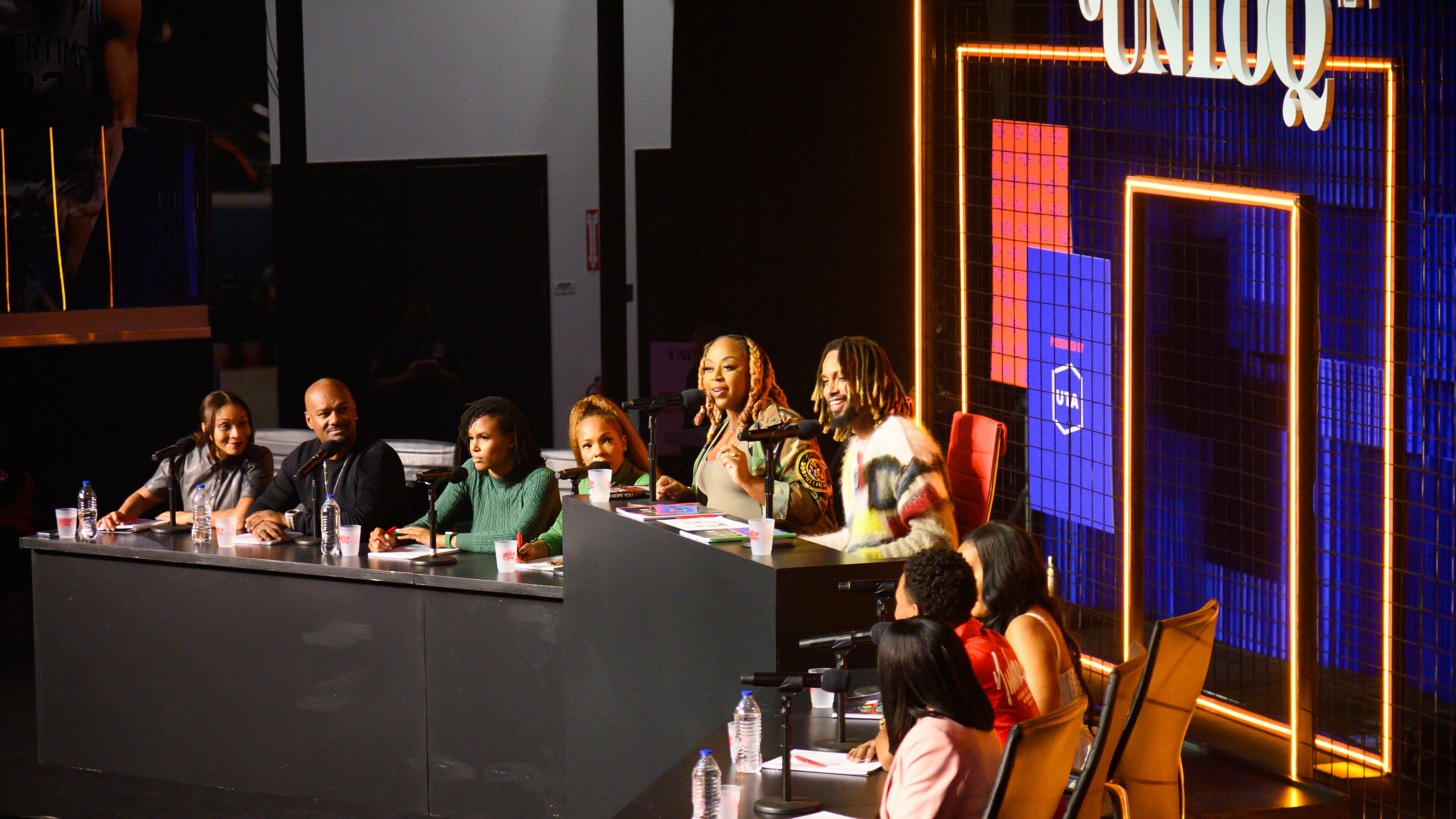Pinky Cole, owner of Slutty Vegan, and Derrick Hayes, owner of Big Dave's Cheesesteaks, on a panel at UNLOQ404, a summit for content creators, on October 14, 2023. (Jamie Spaar for the Atlanta Journal Constitution)
