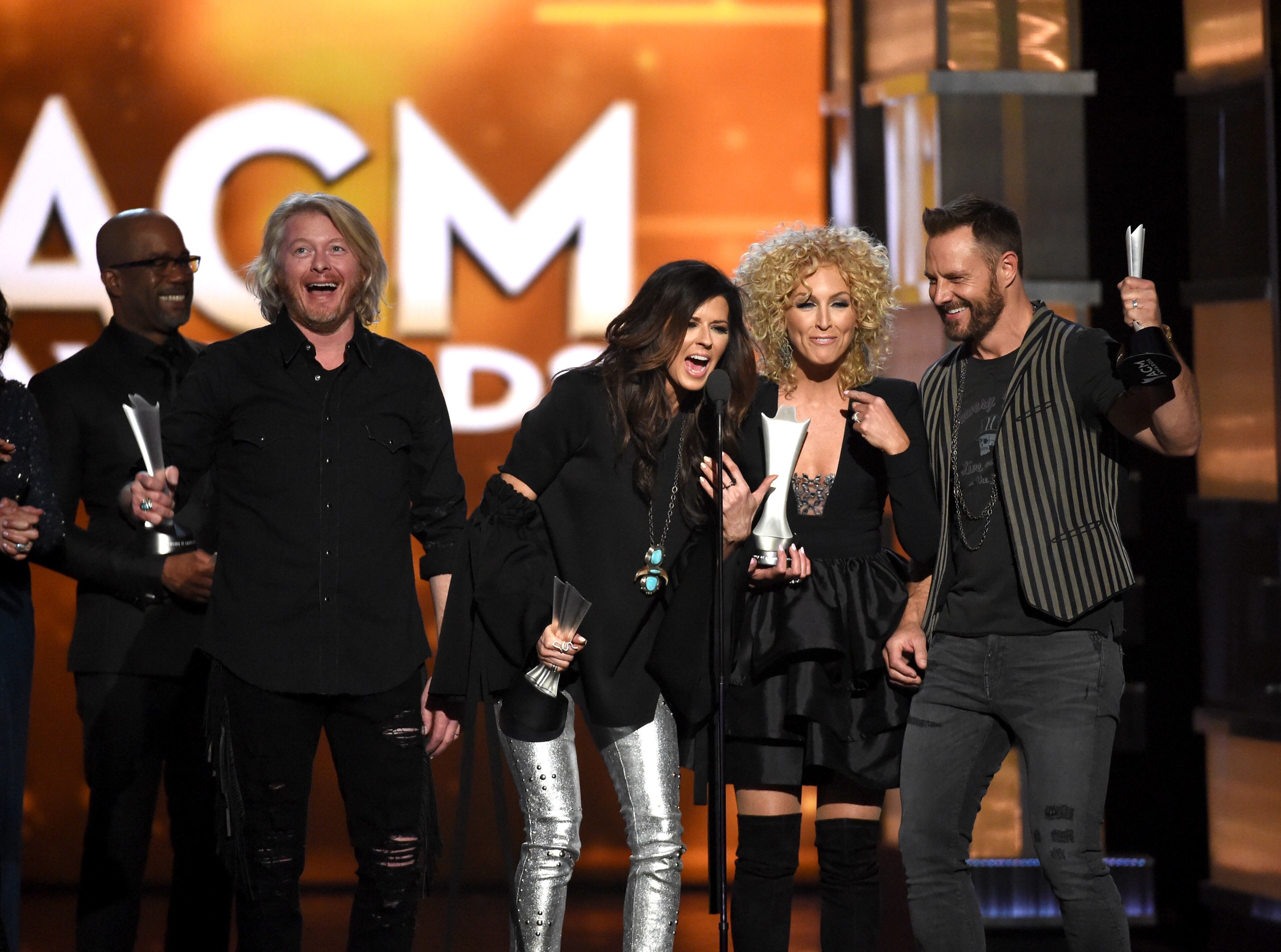 LAS VEGAS, NEVADA - APRIL 03: (L-R) Recording artists Philip Sweet, Karen Fairchild, Kimberly Schlapman, and Jimi Westbrook of music group Little Big Town accept the Vocal Group of the Year award onstage during the 51st Academy of Country Music Awards at MGM Grand Garden Arena on April 3, 2016 in Las Vegas, Nevada. (Photo by Ethan Miller/Getty Images)