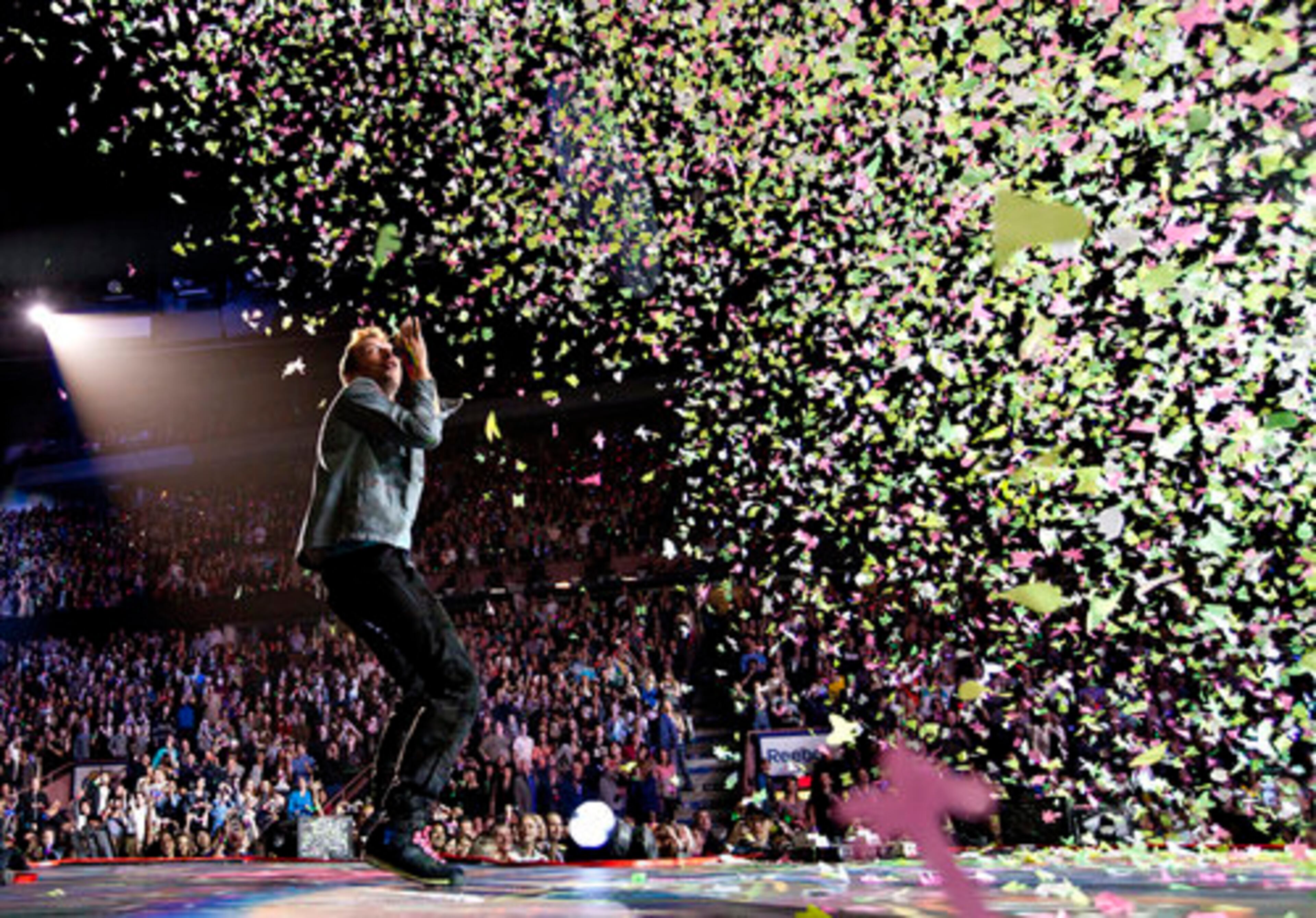 Chris Martin is showered by confetti as he sings "In My Place."