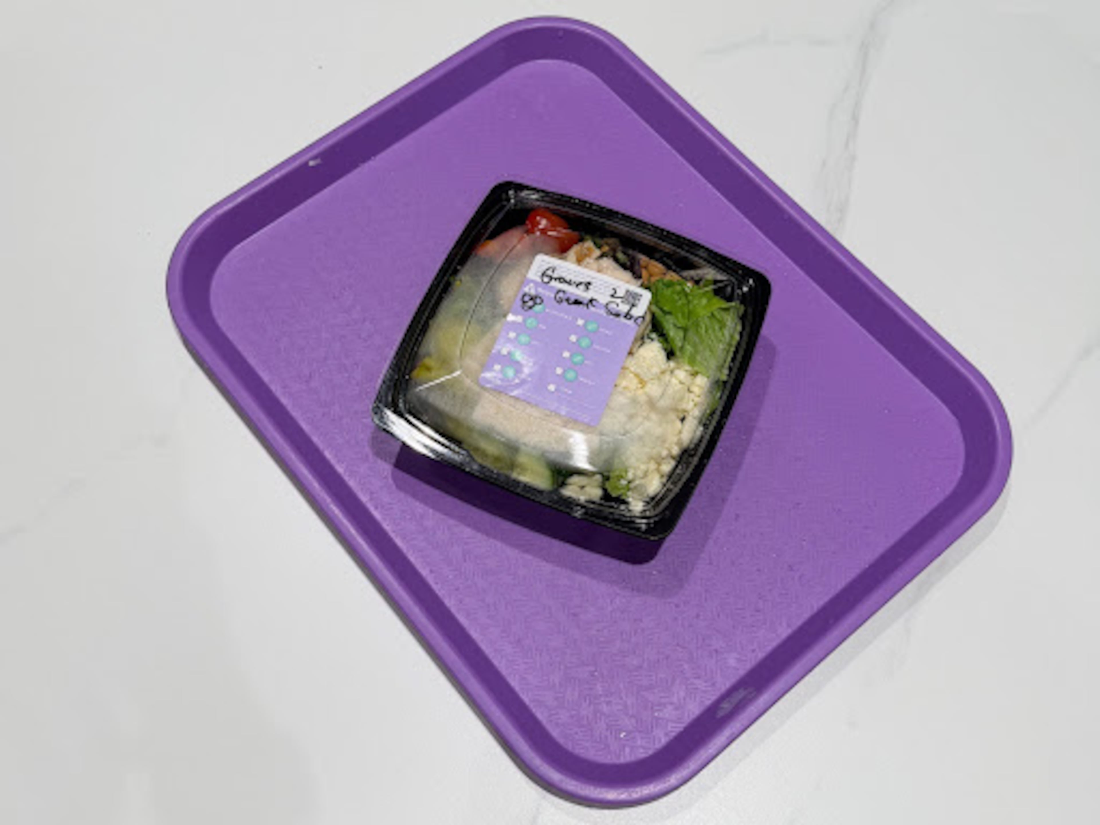 A gluten-free quick-service meal at Walt Disney World will have a purple sticker and sit on a purple tray. (Grace Donovan/AJC)