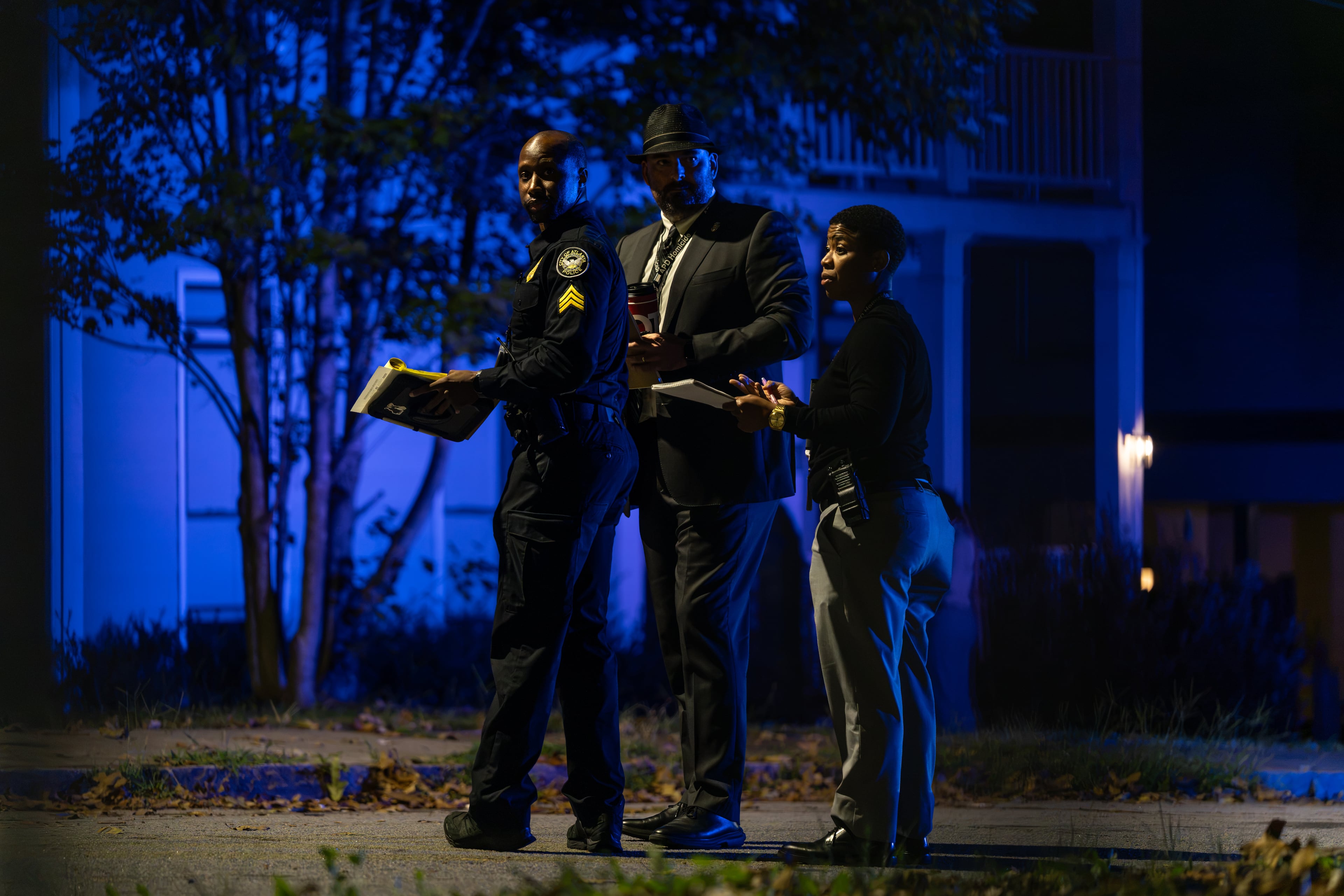 An Atlanta police officer and homicide investigators work the scene of a fatal shooting on Dunning Street early on Saturday, Sept. 26, 2026. (Ben Hendren for the AJC)