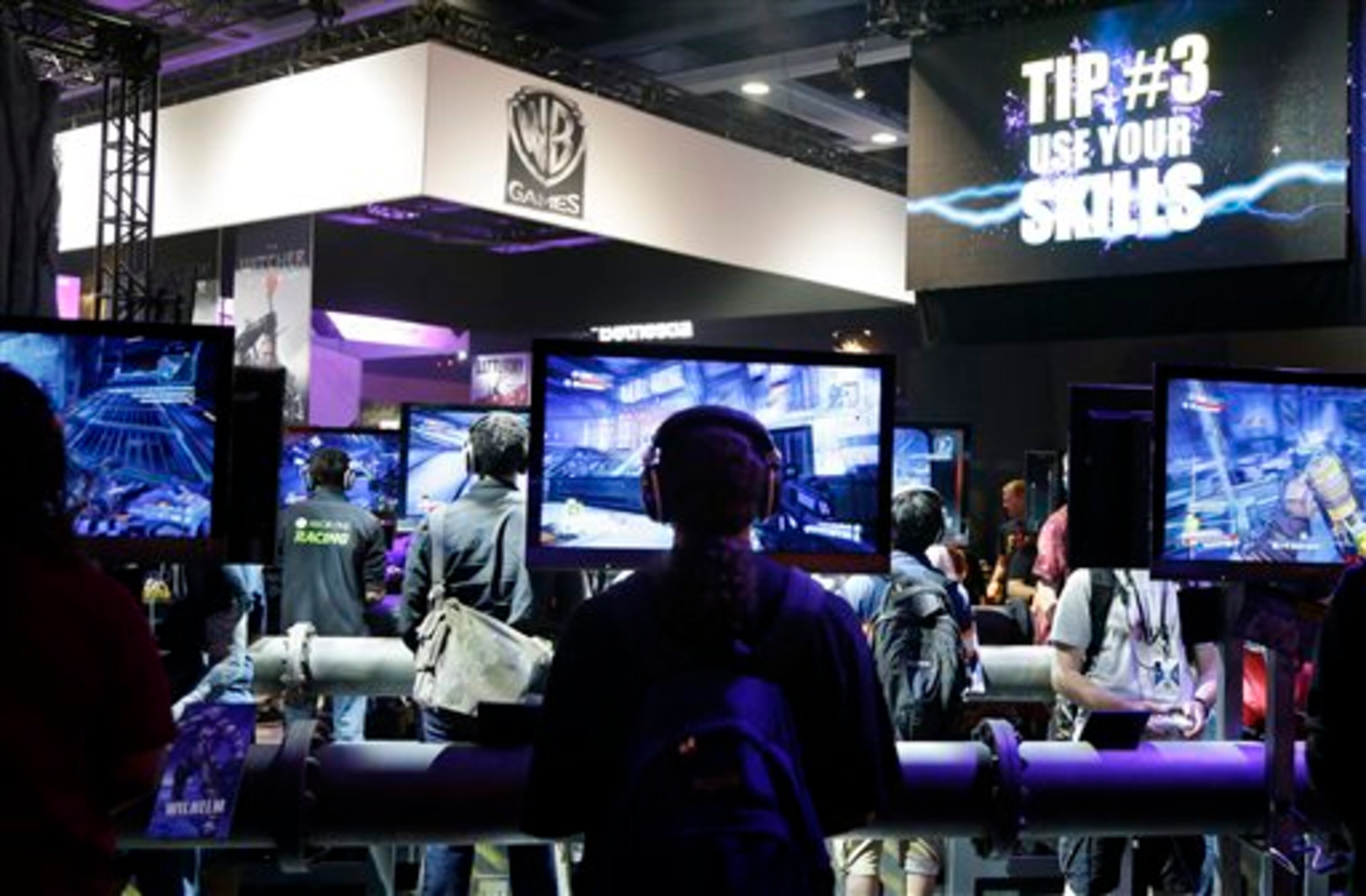 Gamers play the upcoming video game "Borderlands: The Pre-Sequel," scheduled to be released this fall, Friday, Aug. 29, 2014, at the Penny Arcade Expo, a fan-centric celebration of gaming in Seattle. The event is expected to be attended by roughly 85,000 gamers and will include concerts, game tournaments and previews of upcoming titles. (AP Photo/Ted S. Warren)