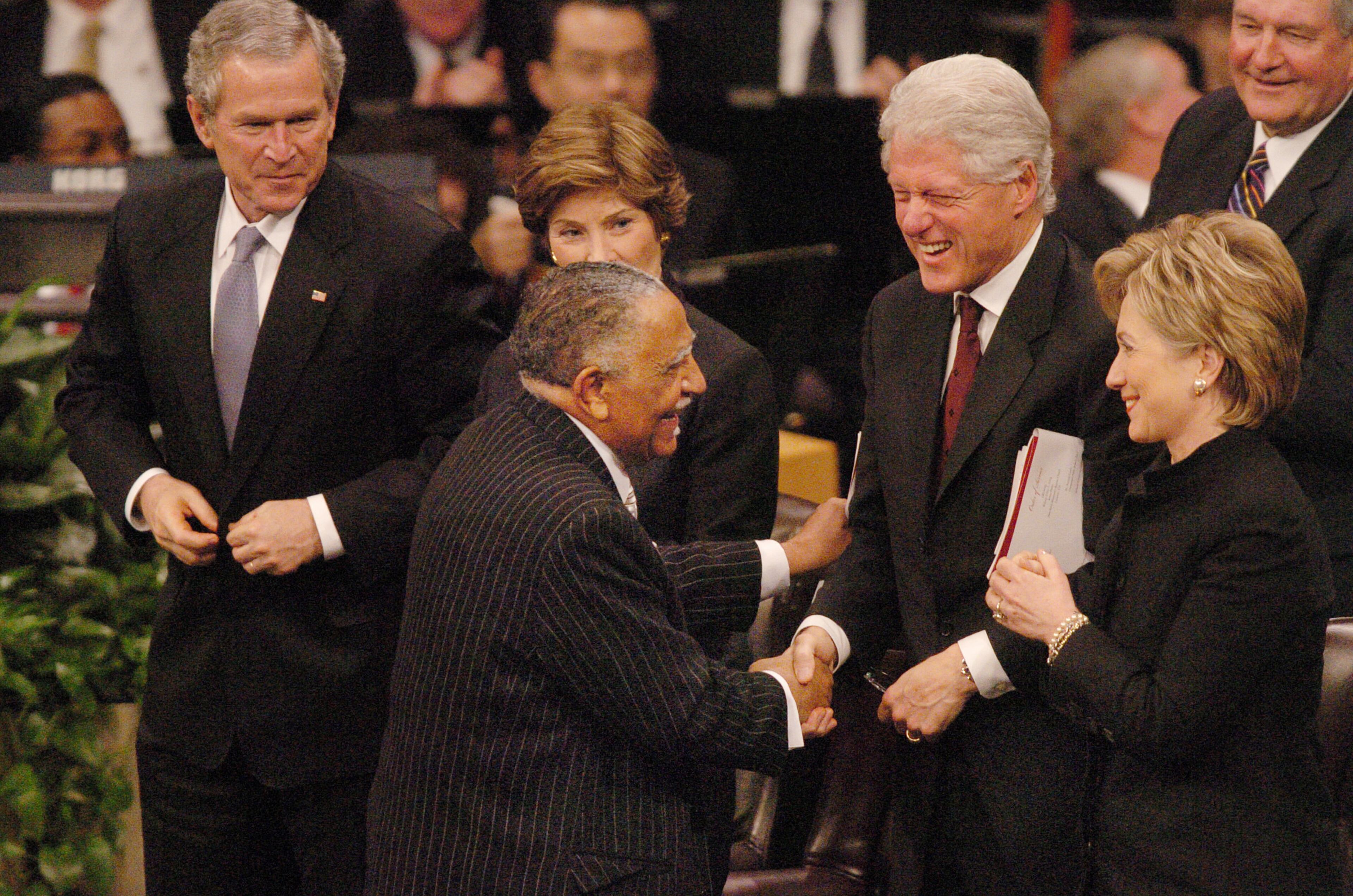 Rev. Joseph Lowery greets President Bill Clinton and his wife, Hillary, at funeral service for Coretta Scott King in 2006. President George Bush and his wife Laura are at Lowery's left. (RENEE HANNANS HENRY/AJC staff)