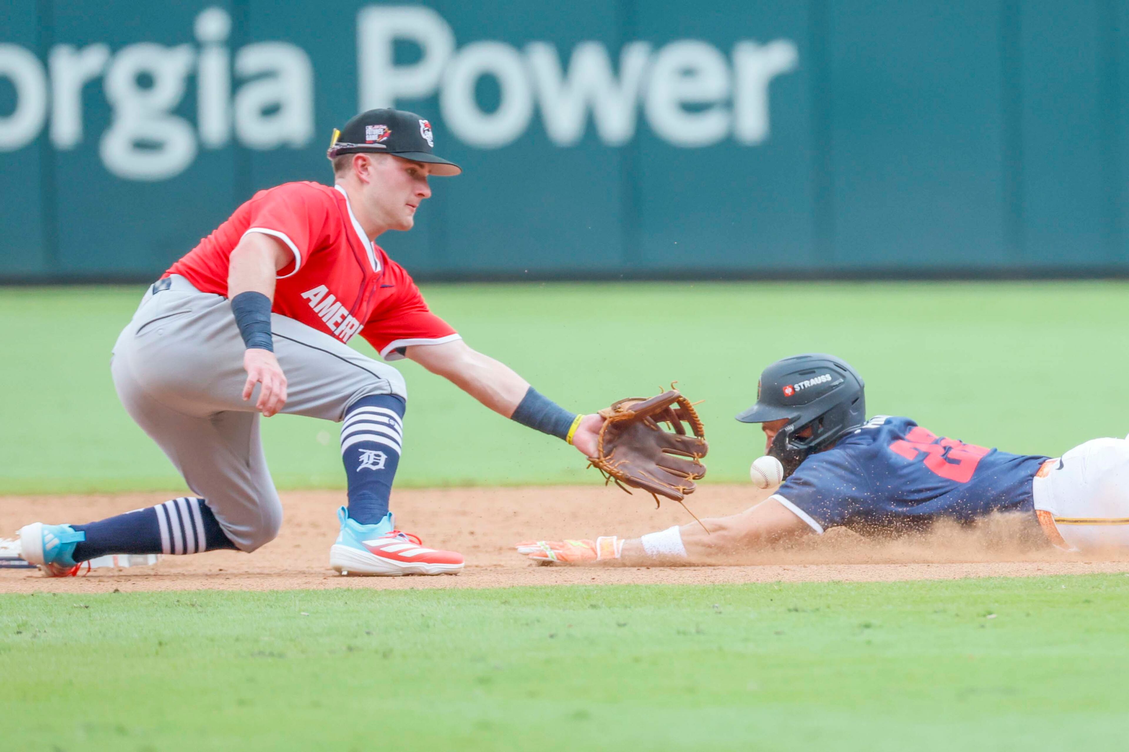 American League infielder Kevin McGonigle (7) of the Detroit Tigers tags out National League pitcher Konnor Griffin (22) during the MLB All-Star Futures Game at Truist Park on Saturday, July 12, 2025, in Atlanta.
(Miguel Martinez/ AJC)