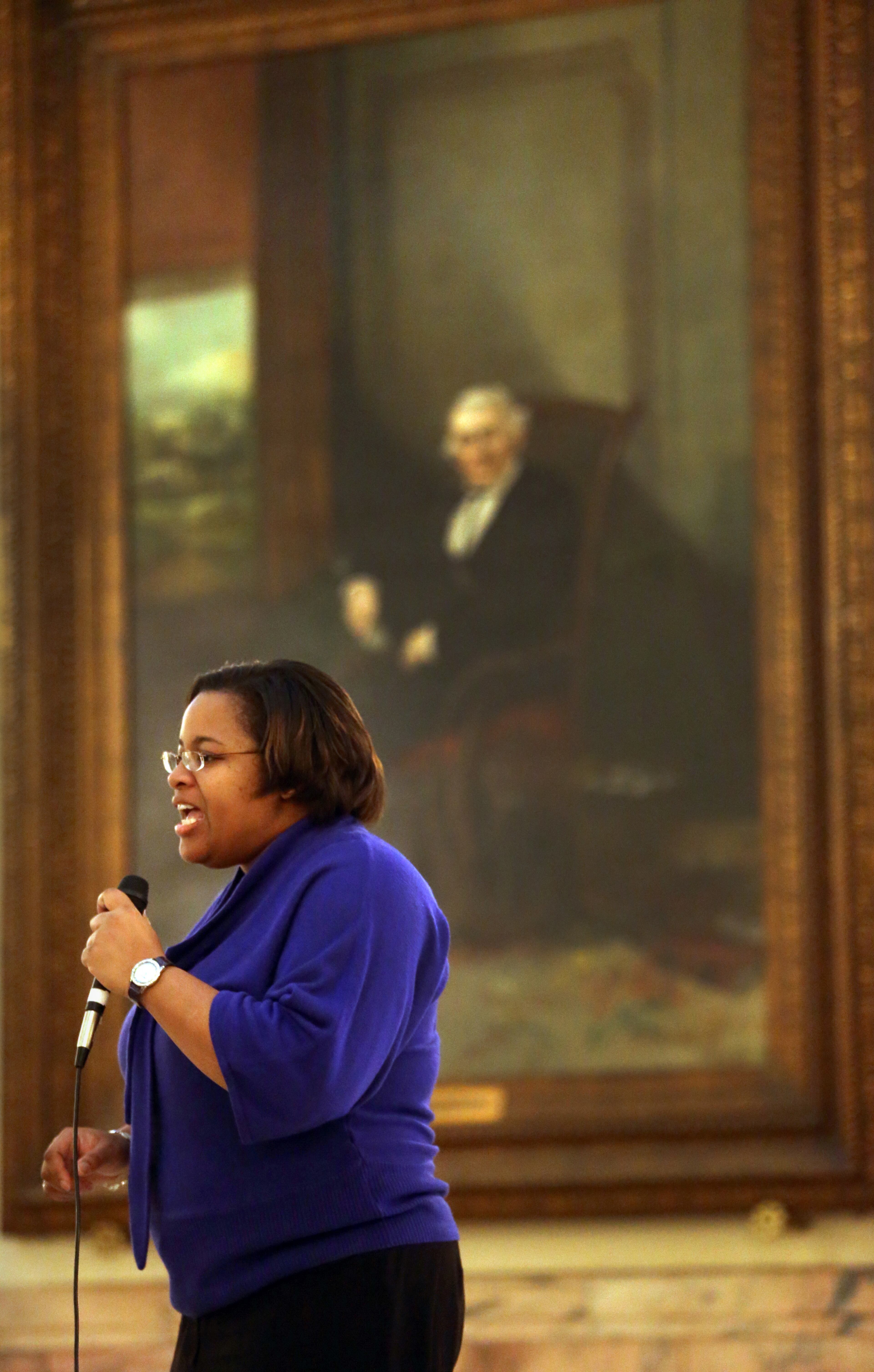DAY 22-Tour manager and museum educator Tracie Murray, of the Georgia Capitol Museum, speaks to a group of students as she stands in front of a portrait of Alexander Hamilton Stephens in the Capitol Rotunda.