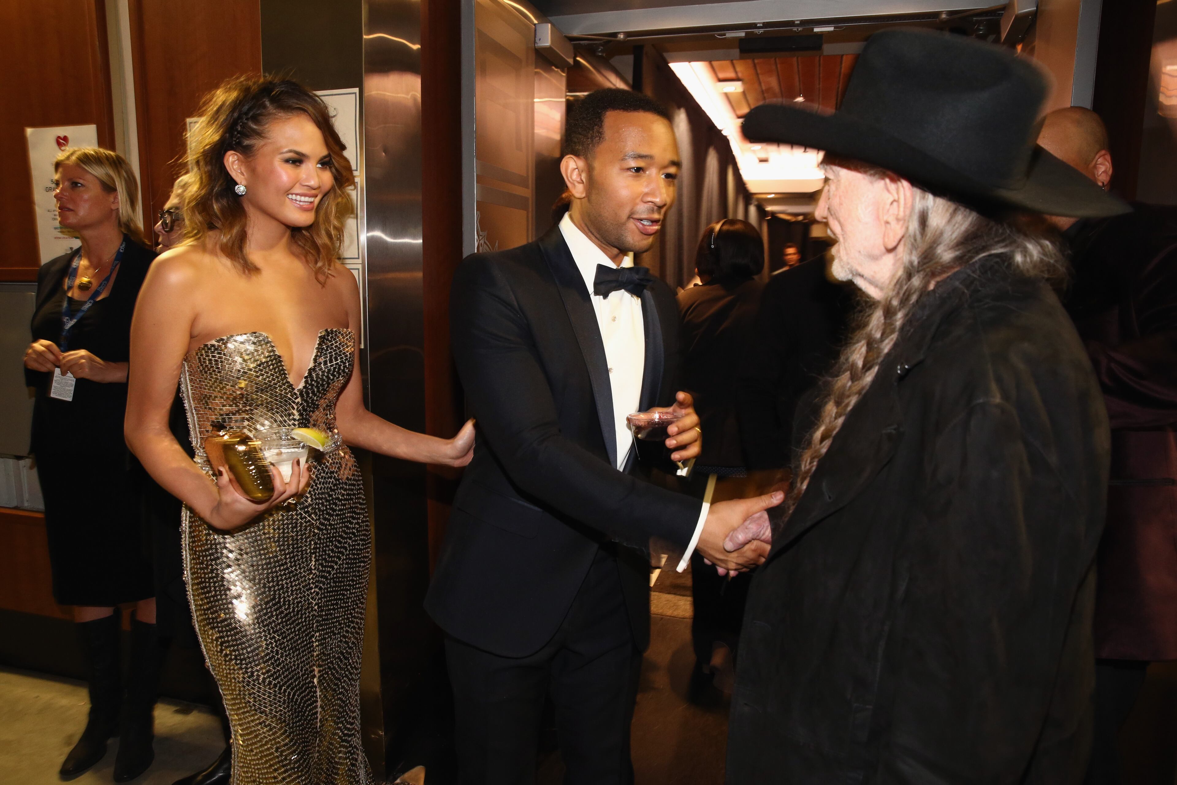 LOS ANGELES, CA - JANUARY 26: Model Christine Teigen, singer John Legend and musician Willie Nelson attend the 56th GRAMMY Awards at Staples Center on January 26, 2014 in Los Angeles, California. (Photo by Christopher Polk/Getty Images)