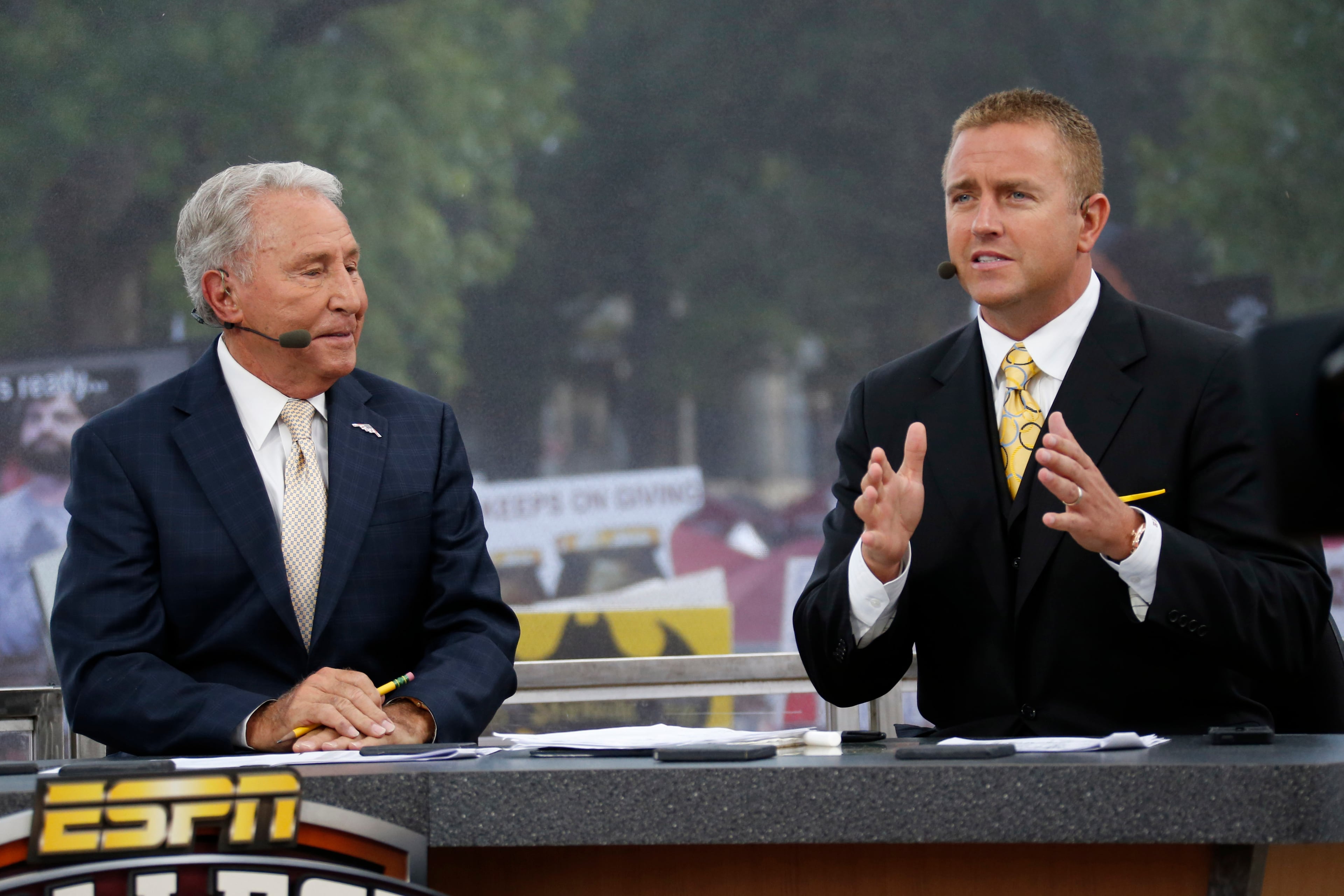 ESPN College GameDay hosts Lee Corso (left) talks with Kirk Herbstreit in 2014.