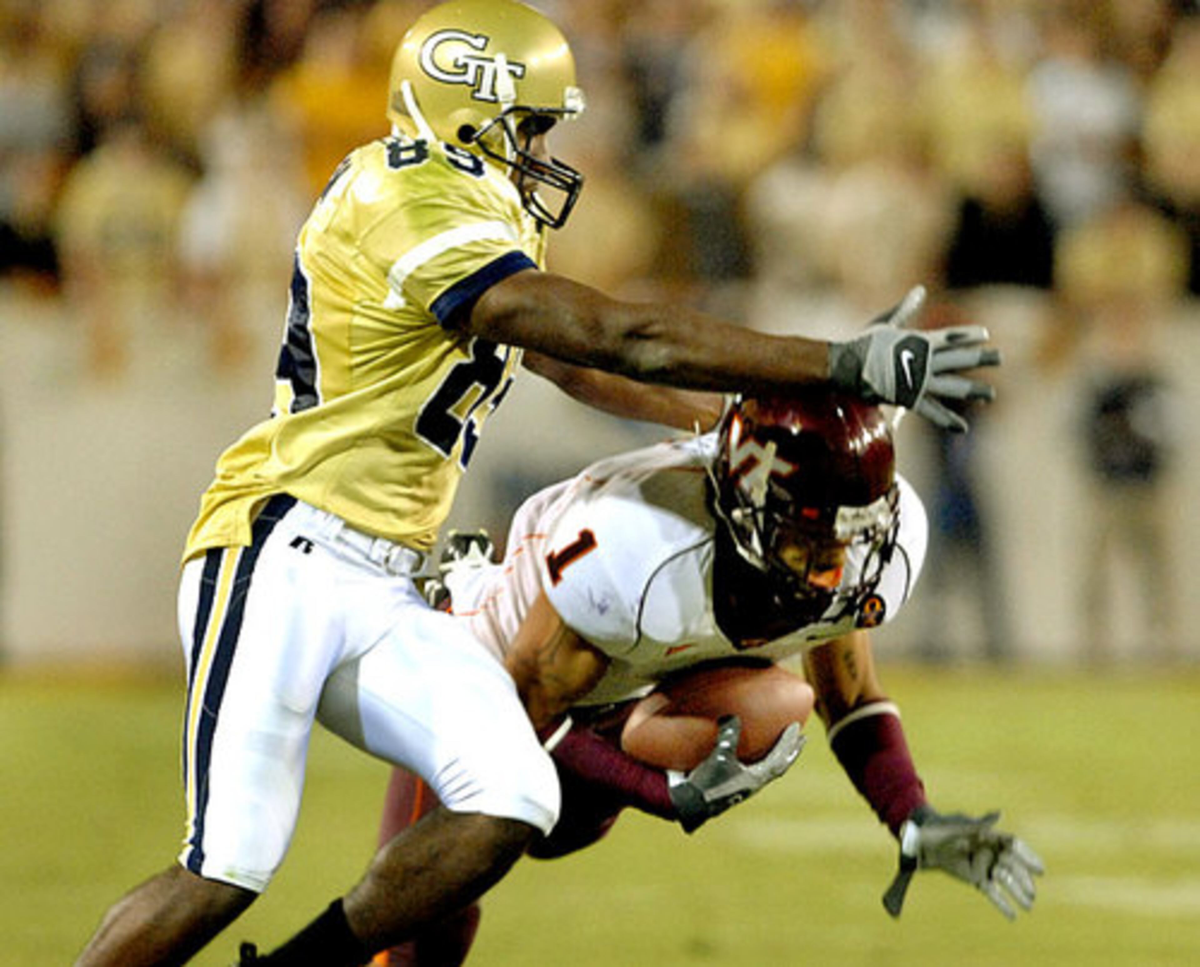 Virginia Tech defensive back Victor Harris (1) steps in front of Georgia Tech wide receiver James Johnson (89) for an interception in the second quarter.