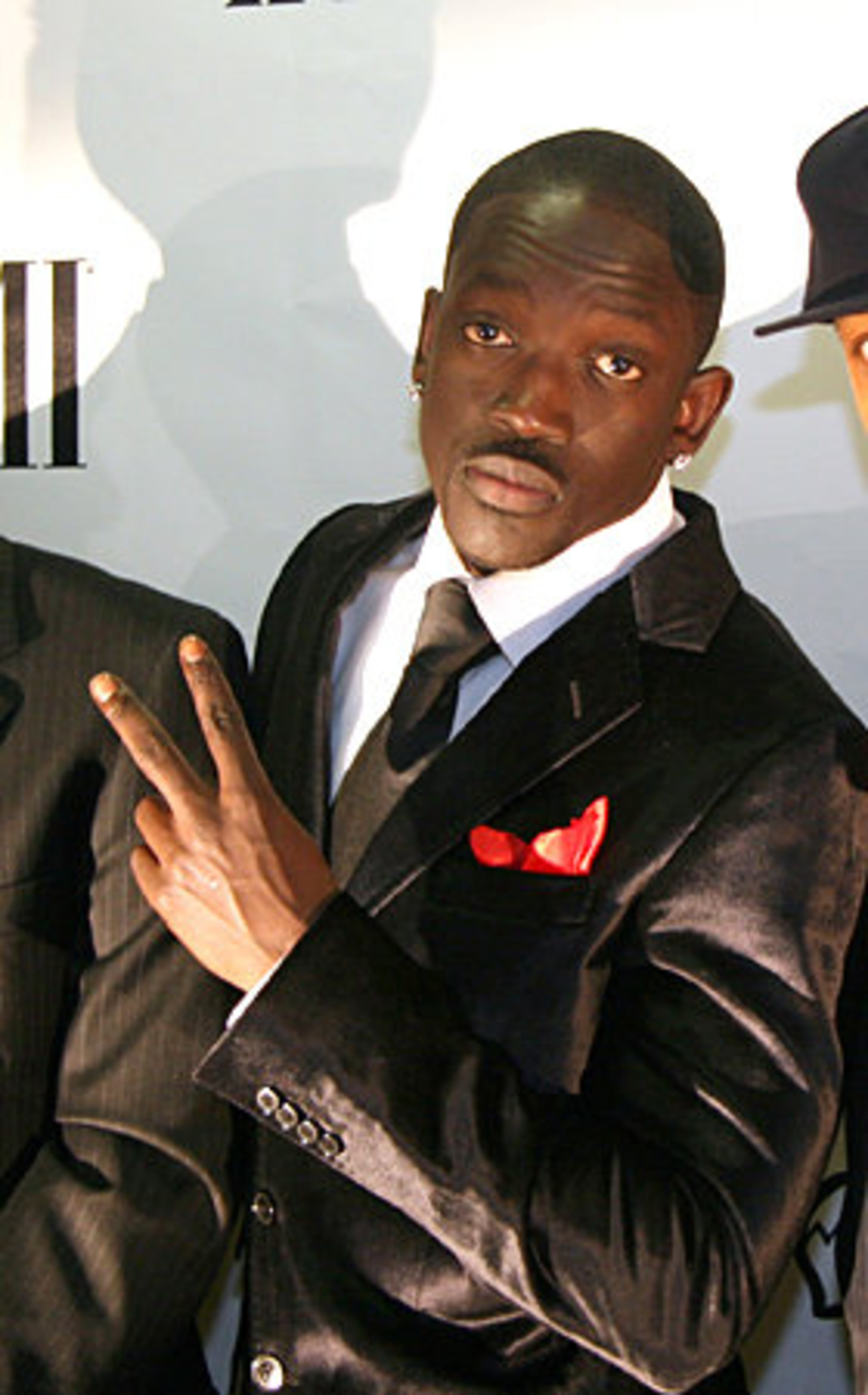 Bu, vice president of Konvict Music arrives at the party.