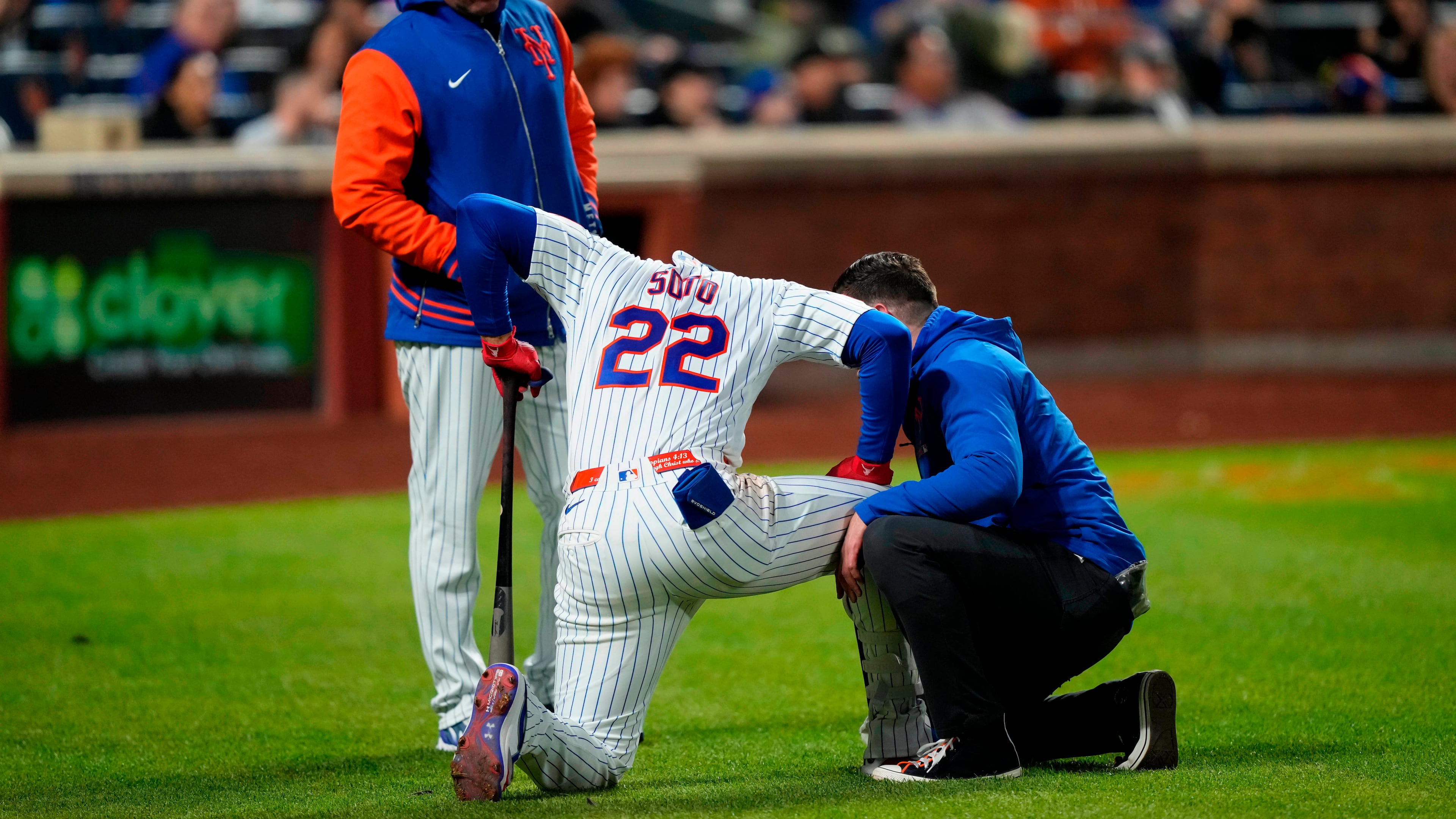 New York Mets designated hitter Juan Soto (22) reacts after getting hit by the ball on his ankle during the third inning of a baseball game against the Detroit Tigers, Wednesday, May 13, 2026, in New York. (AP Photo/Yuki Iwamura)