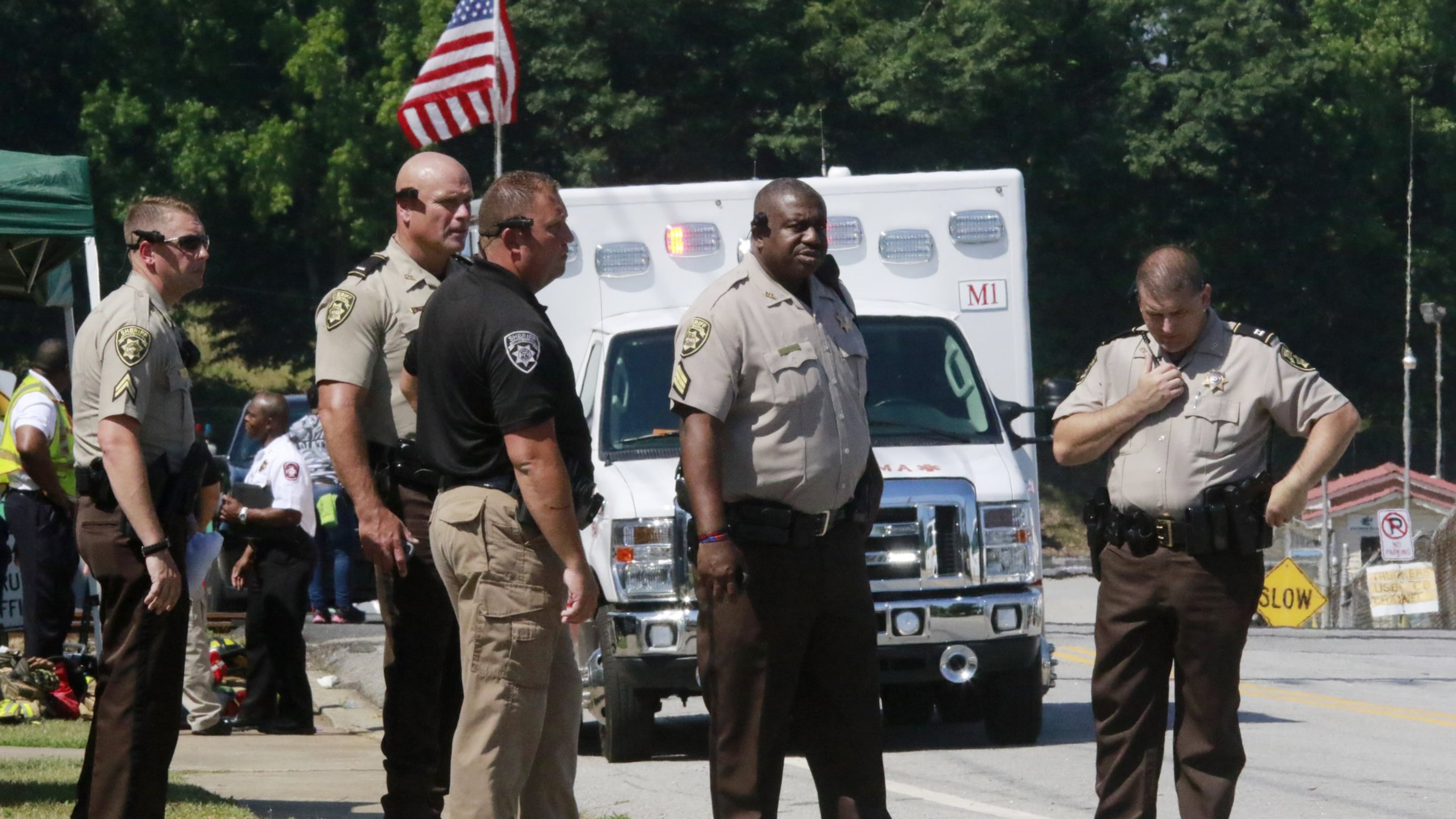 Coweta sheriff’s deputies stand at the entrance to Bonnell after the explosion. BOB ANDRES / BANDRES@AJC.COM