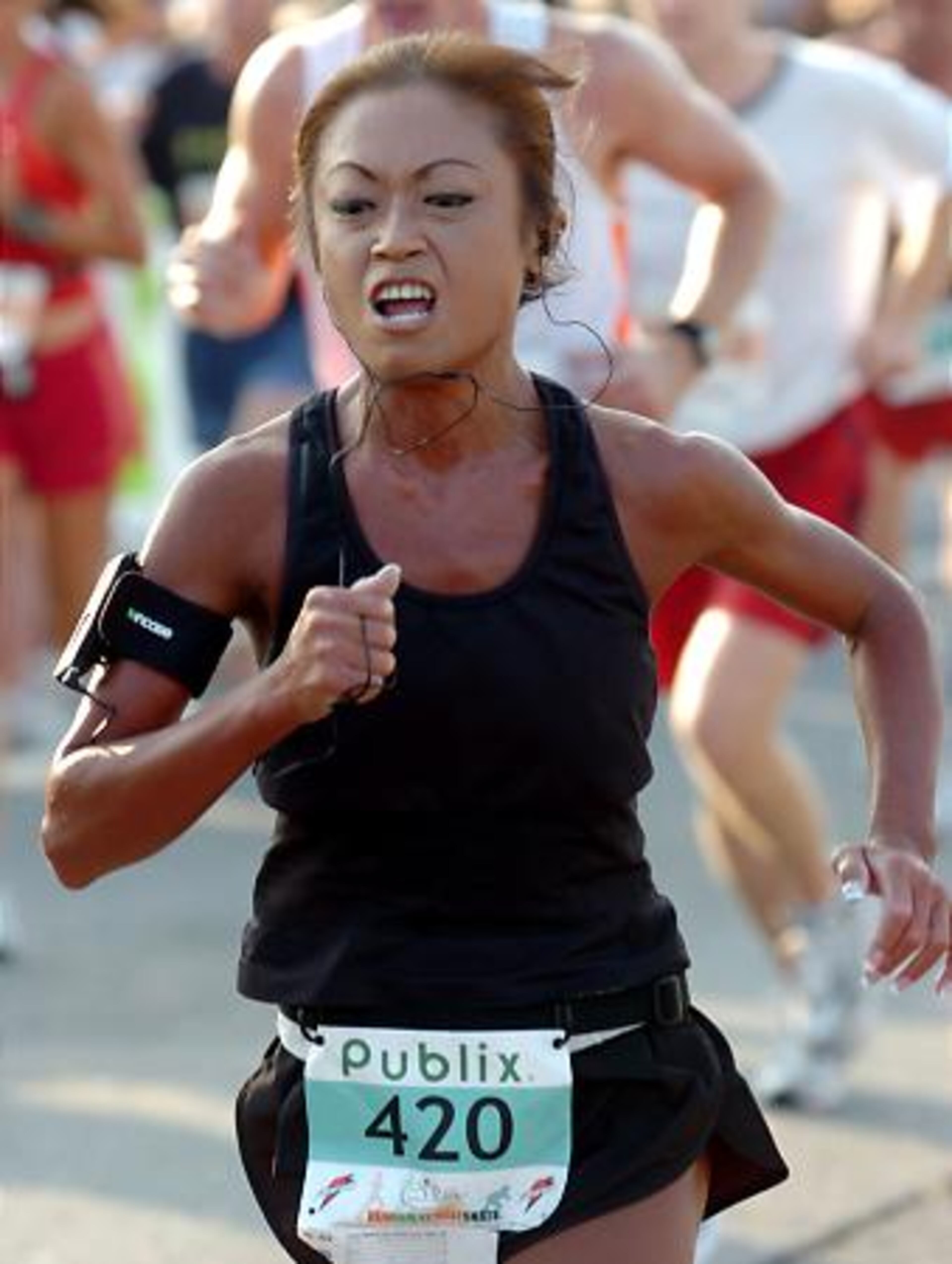 Lorna Loh, 43, of Marietta, gives it her best effort not far from the finish line.