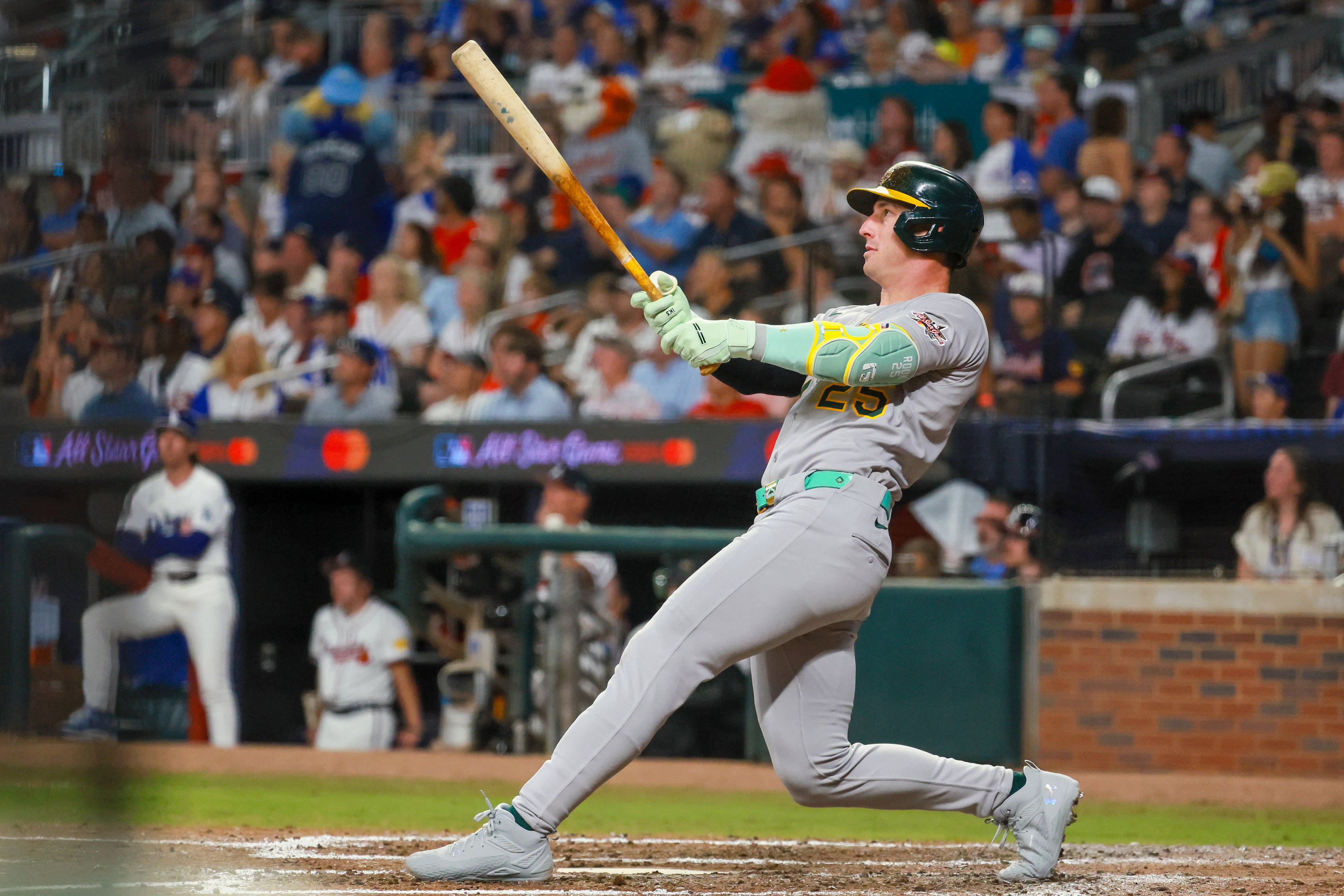 American League designated hitter Brent Rooker of the Oakland A's hits a three-run homer against the National League during the seventh inning of the MLB All-Star Game at Truist Park in Atlanta on Tuesday, July 15, 2025. (Jason Getz/AJC)