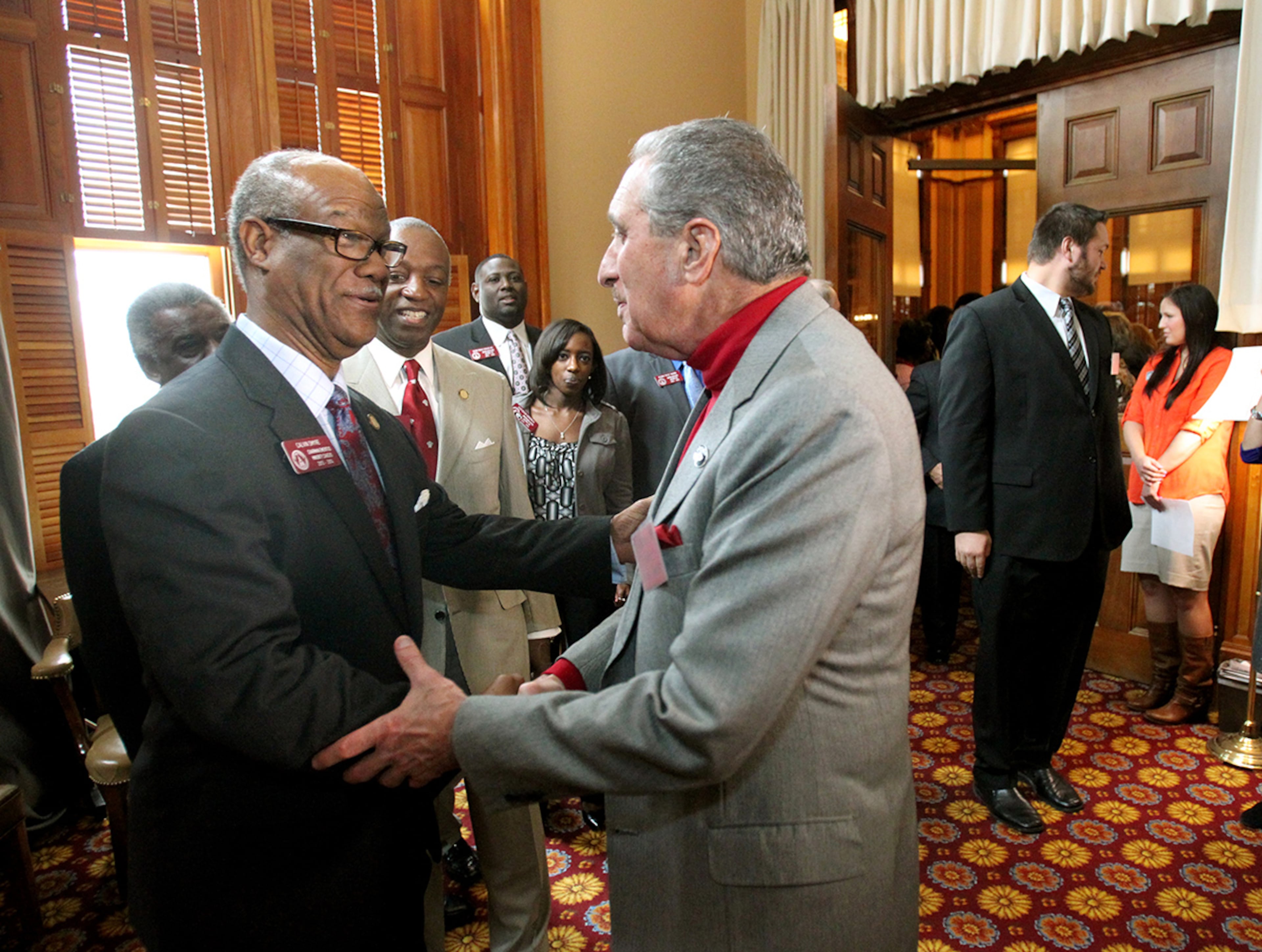 Rep. Calvin Smyre, D-Columbus (left), briefly interacts with Falcons owner Arthur Blank.