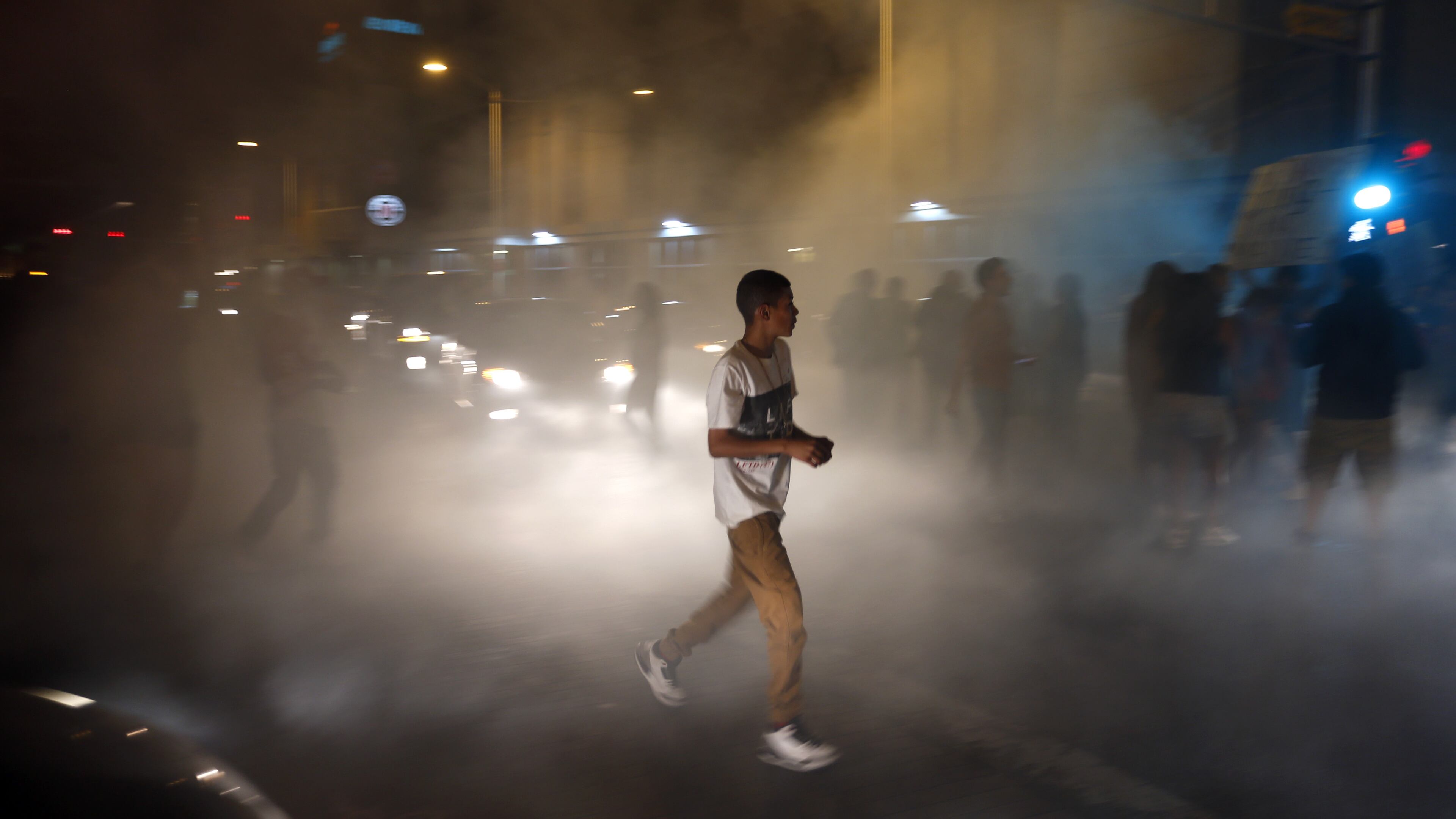 Anti-Trump protesters block the streets following a rally and speech by Republican presidential candidate Donald Trump at the convention center where the event was held, in Albuquerque, N.M., Tuesday, May 24, 2016. (AP Photo/Brennan Linsley)