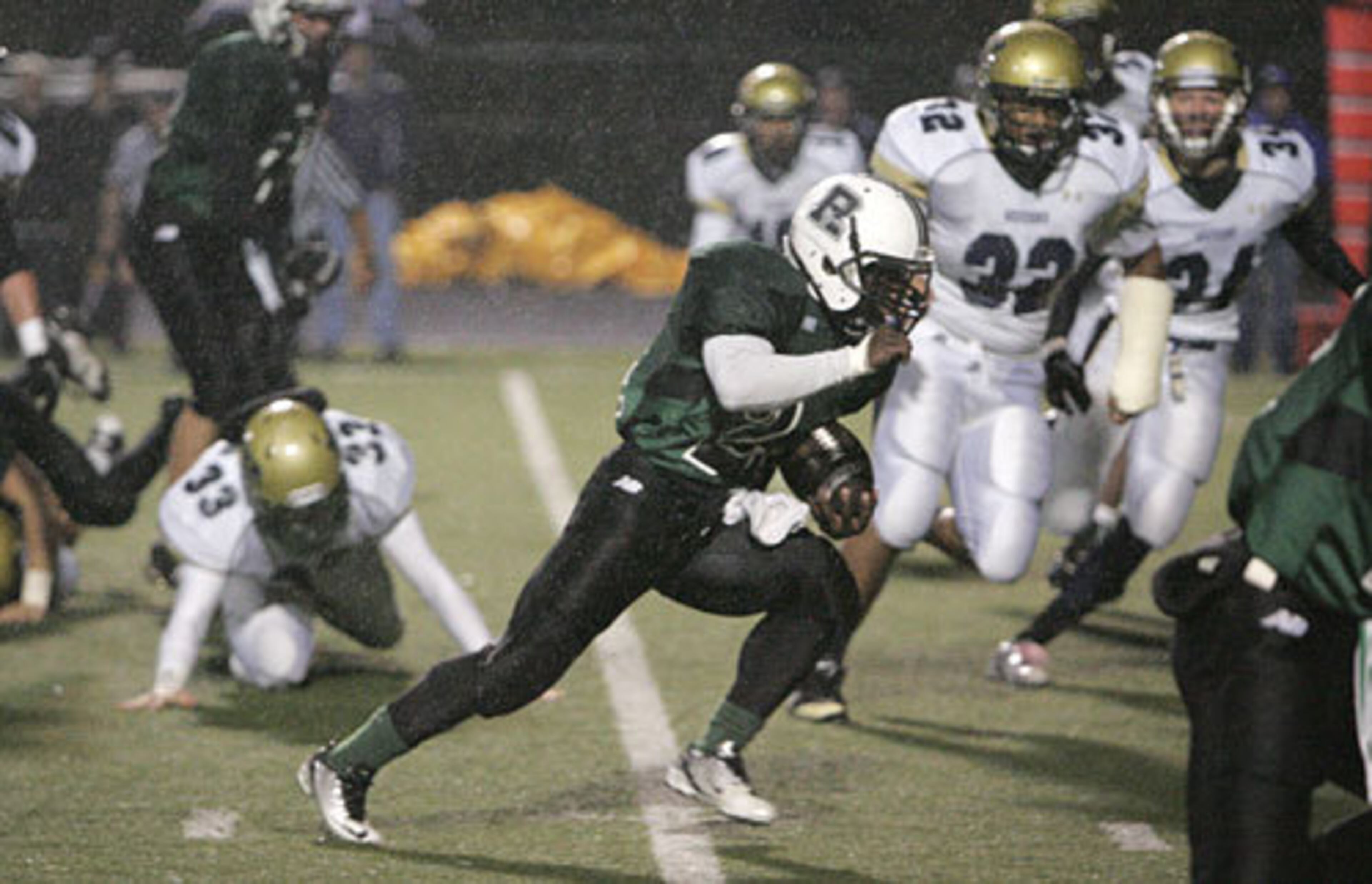 Roswell running back Corey Wilson runs up the middle against West Forsyth during the first half.
