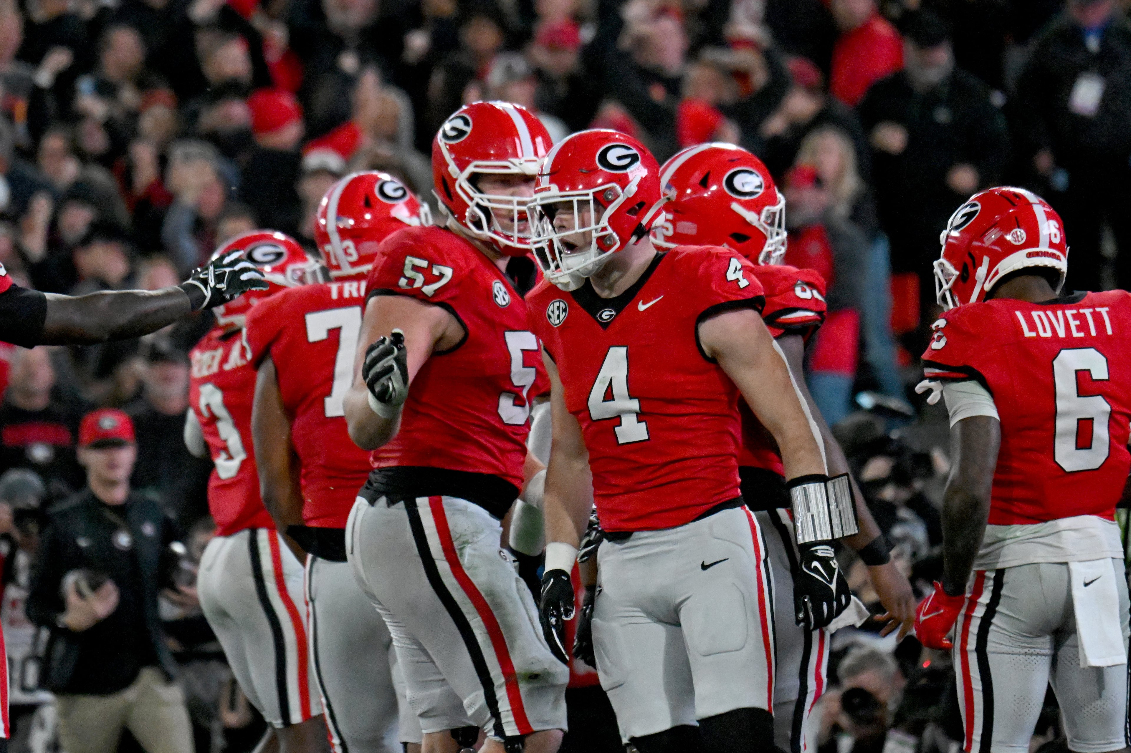 Georgia tight end Oscar Delp (4) celebrates after catching a touchdown pass from Carson Beck during Saturday's game against Tennessee in Athens. (Hyosub Shin / AJC)