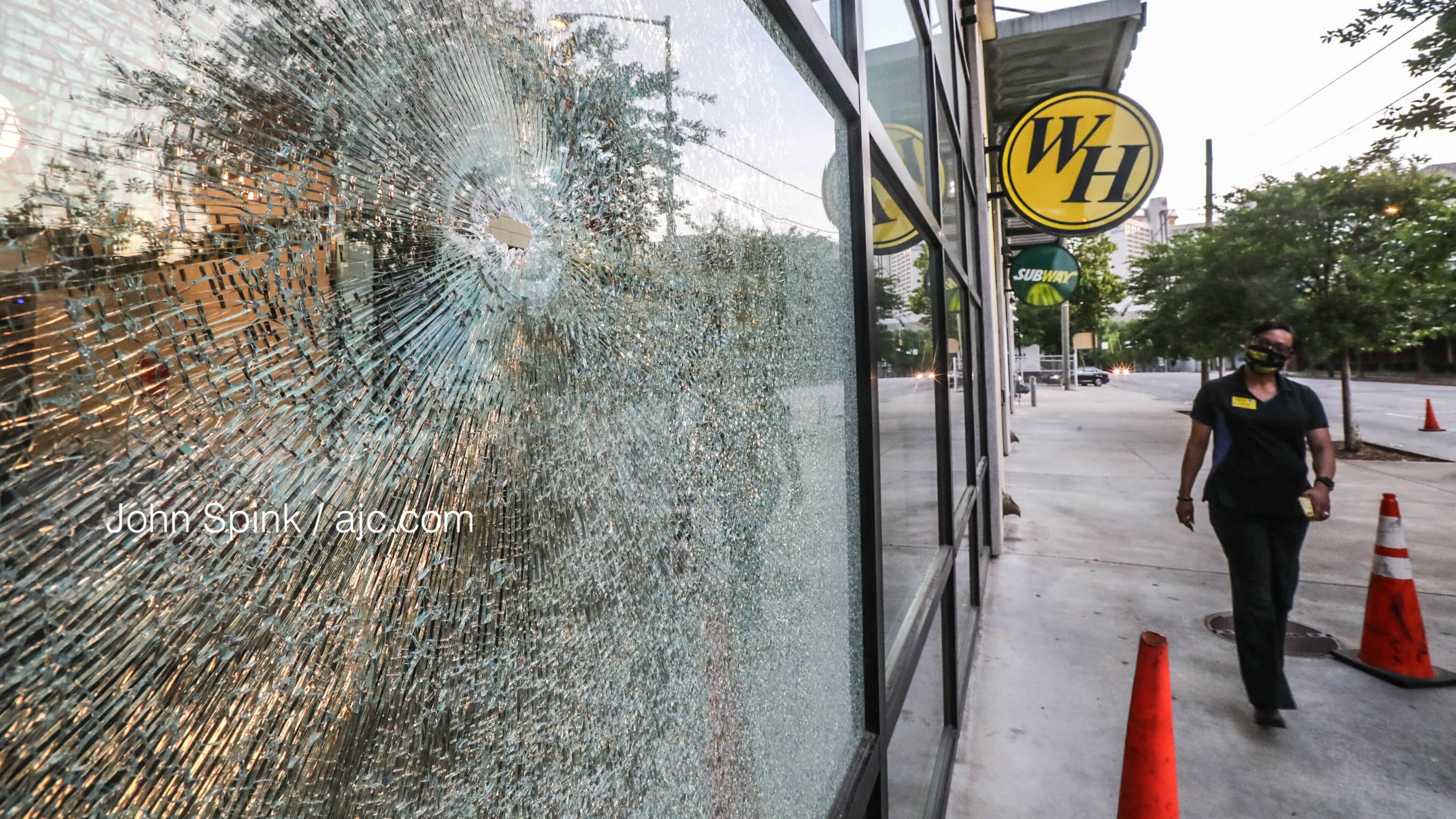 Bullets hit the front of the Waffle House on Courtland Street and injured an innocent bystander, according to a spokeswoman for the restaurant.
