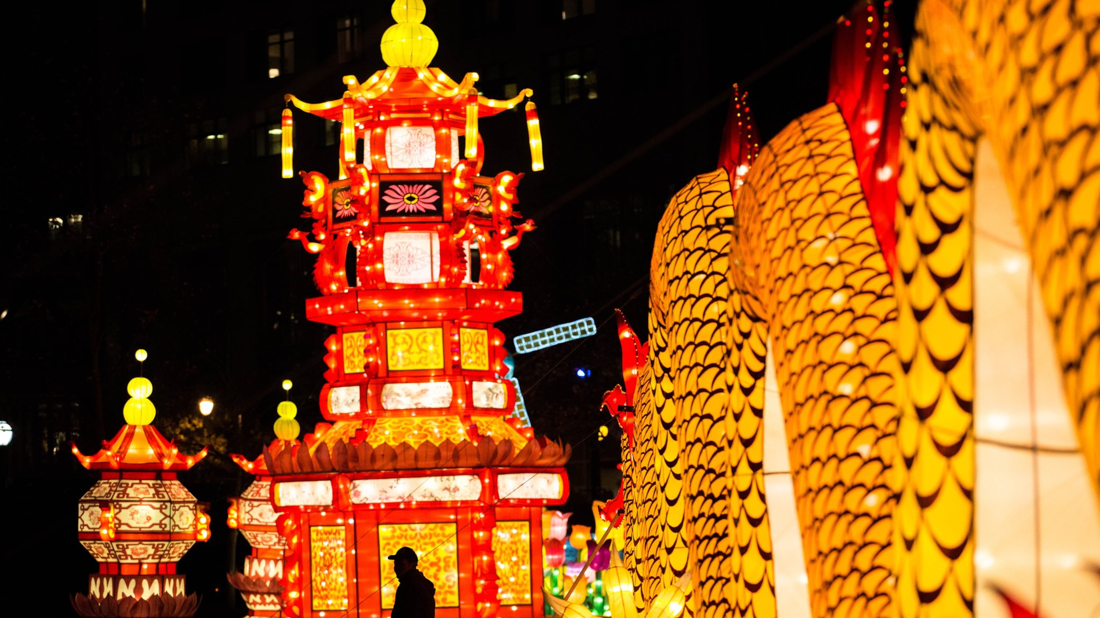 A man is silhouetted against the Chinese Palace lantern at the Chinese Lantern Festival in Centennial Olympic Park, Friday, Dec. 9, 2016, in Atlanta. Branden Camp/Special