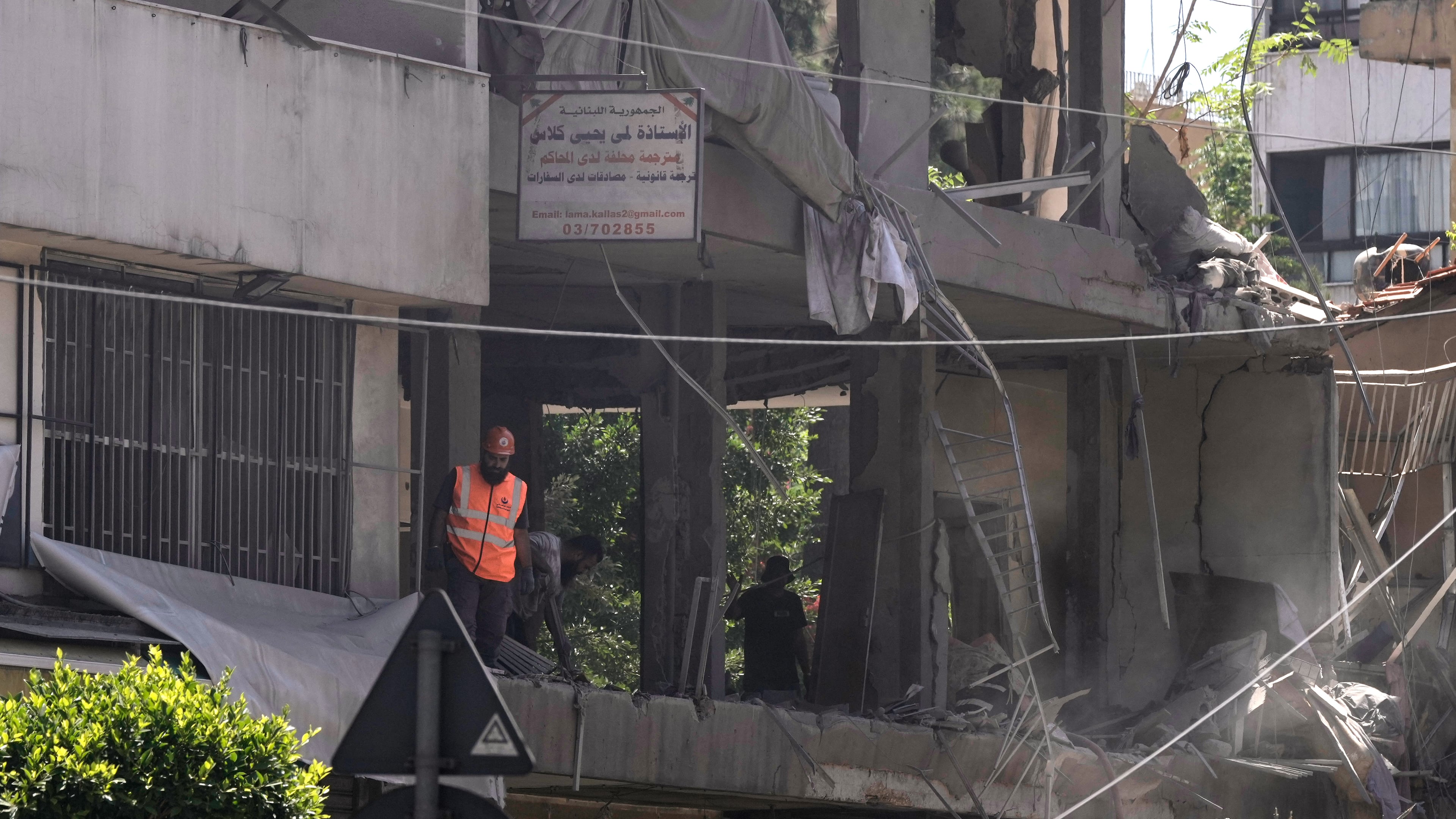 A rescue worker checks an apartment that was hit in an Israeli airstrike in Dahiyeh, Beirut's southern suburbs, Lebanon, Sunday, June 14, 2026. (AP Photo/Bilal Hussein)