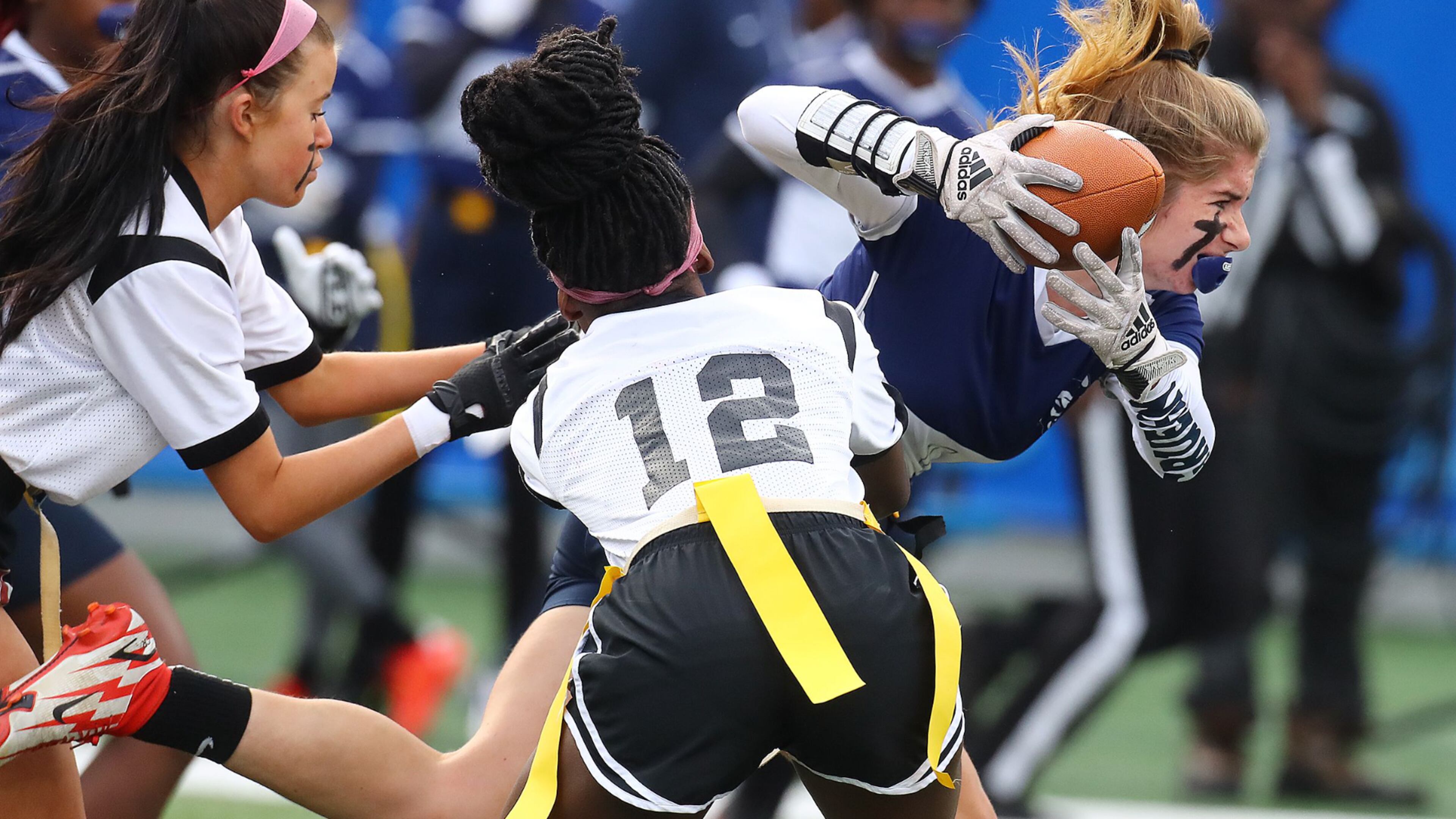 120921 Atlanta: Marietta running back Cate Gruehn makes a first down run against Hillgrove on the team's lone scoring drive in their GHSA Flag Football Championship Division 3 game on Thursday, Dec 9, 2021, in Atlanta. “Curtis Compton / Curtis.Compton@ajc.com”`