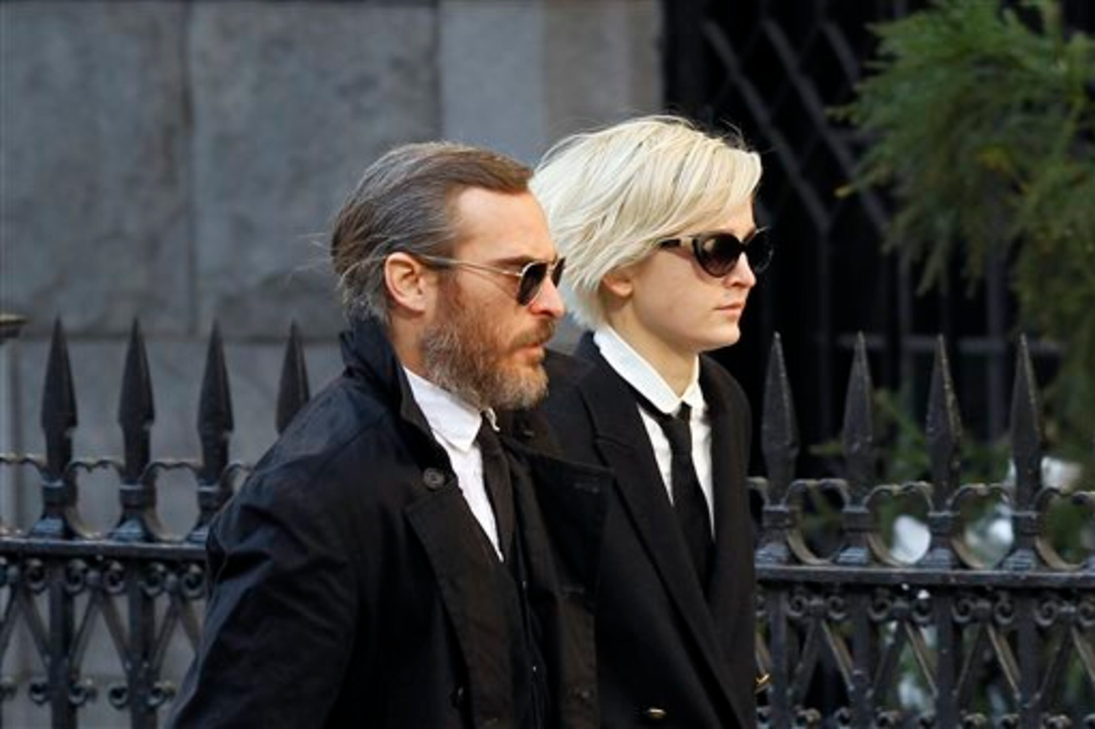 Actor Joaquin Phoenix arrives at the Church of St. Ignatius Loyola for the private funeral of actor Philip Seymour Hoffman Friday, Feb. 7, 2014, in New York. Hoffman, 46, was found dead Sunday of an apparent heroin overdose. (AP Photo/Jason DeCrow)