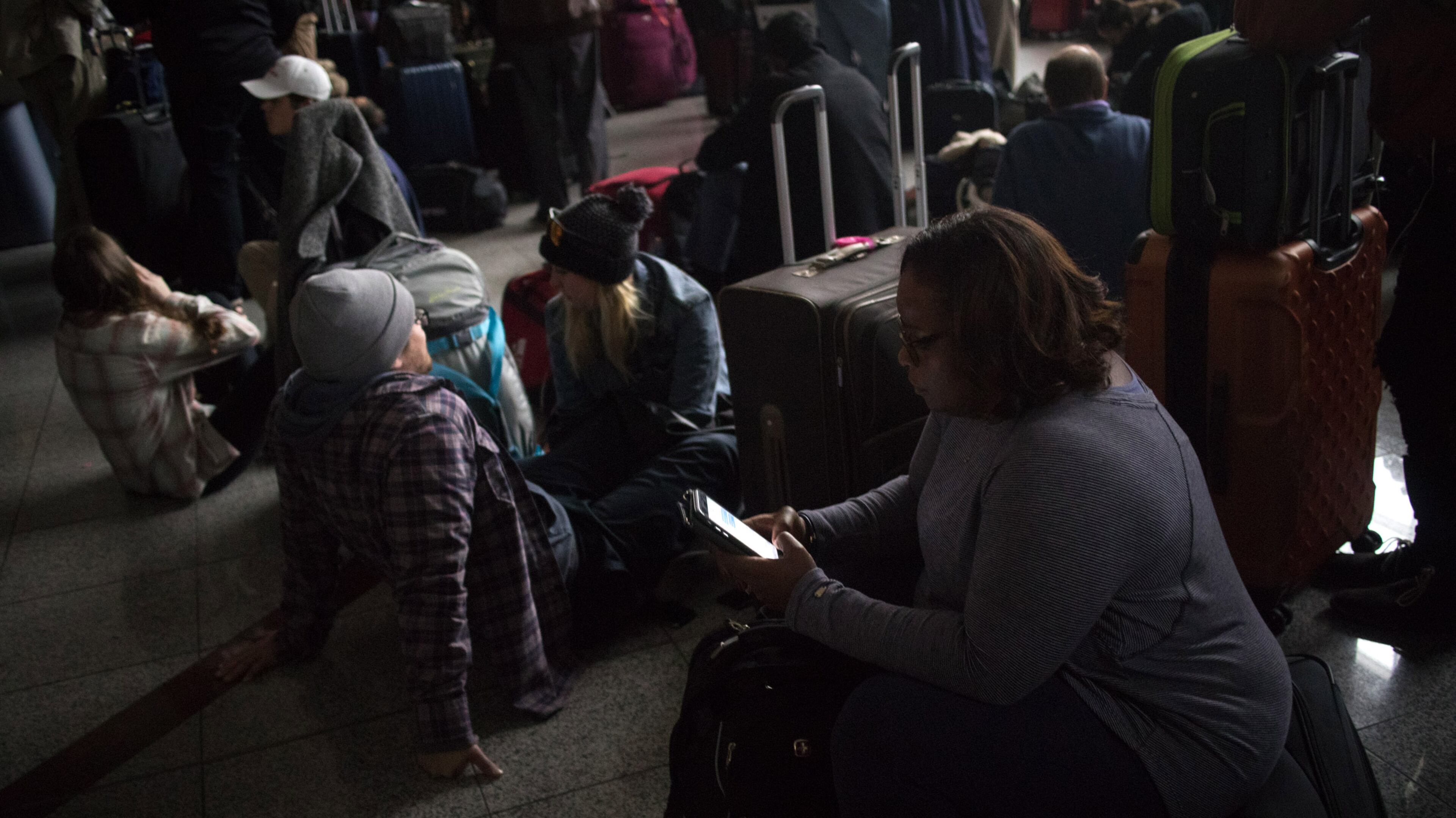 Passengers wait for power to be restored on Sunday, Dec. 17, 2017, at Hartsfield-Jackson International Airport. The outage began after 1 p.m. and lasted until about midnight.