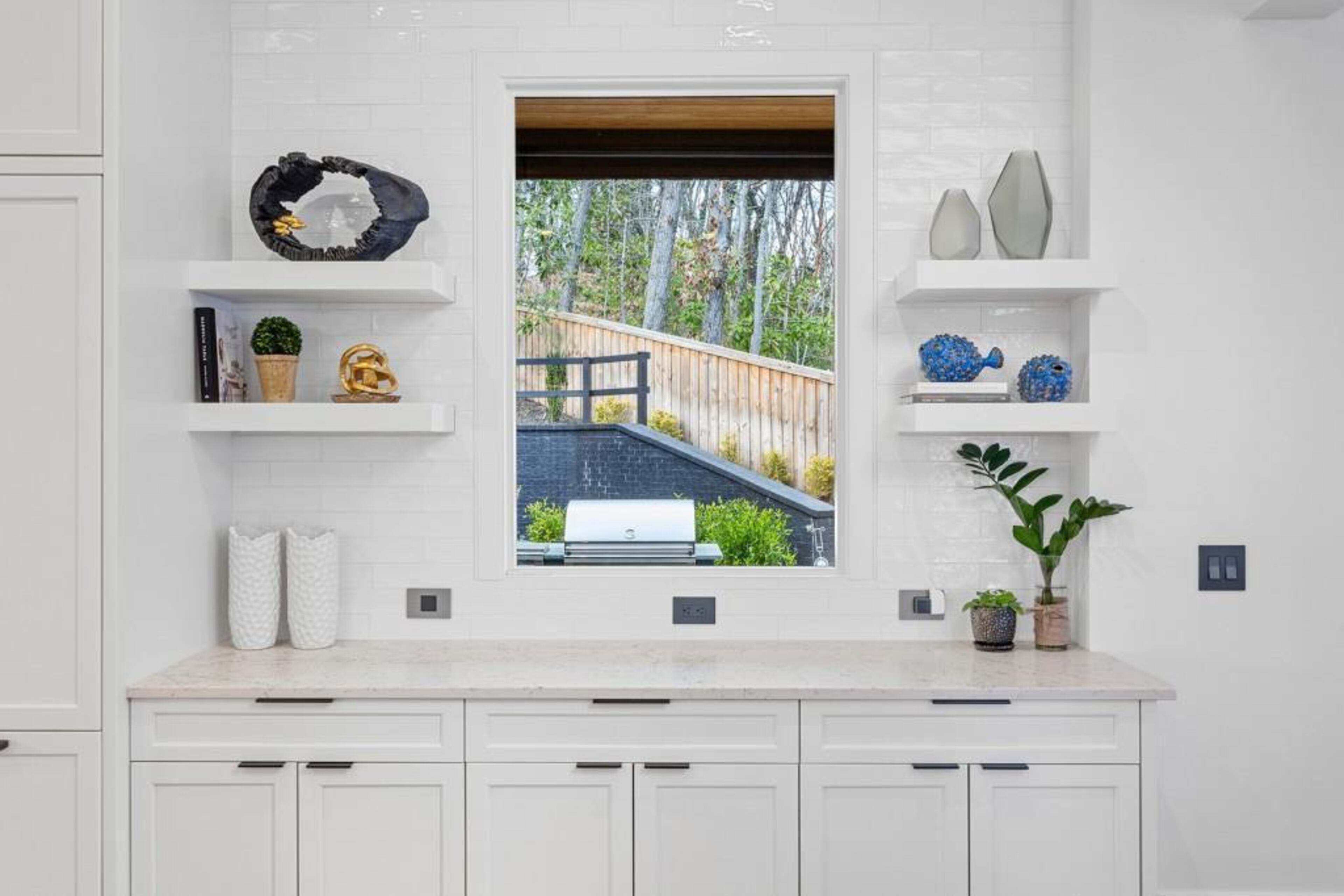 Kitchen window overlooking the backyard.