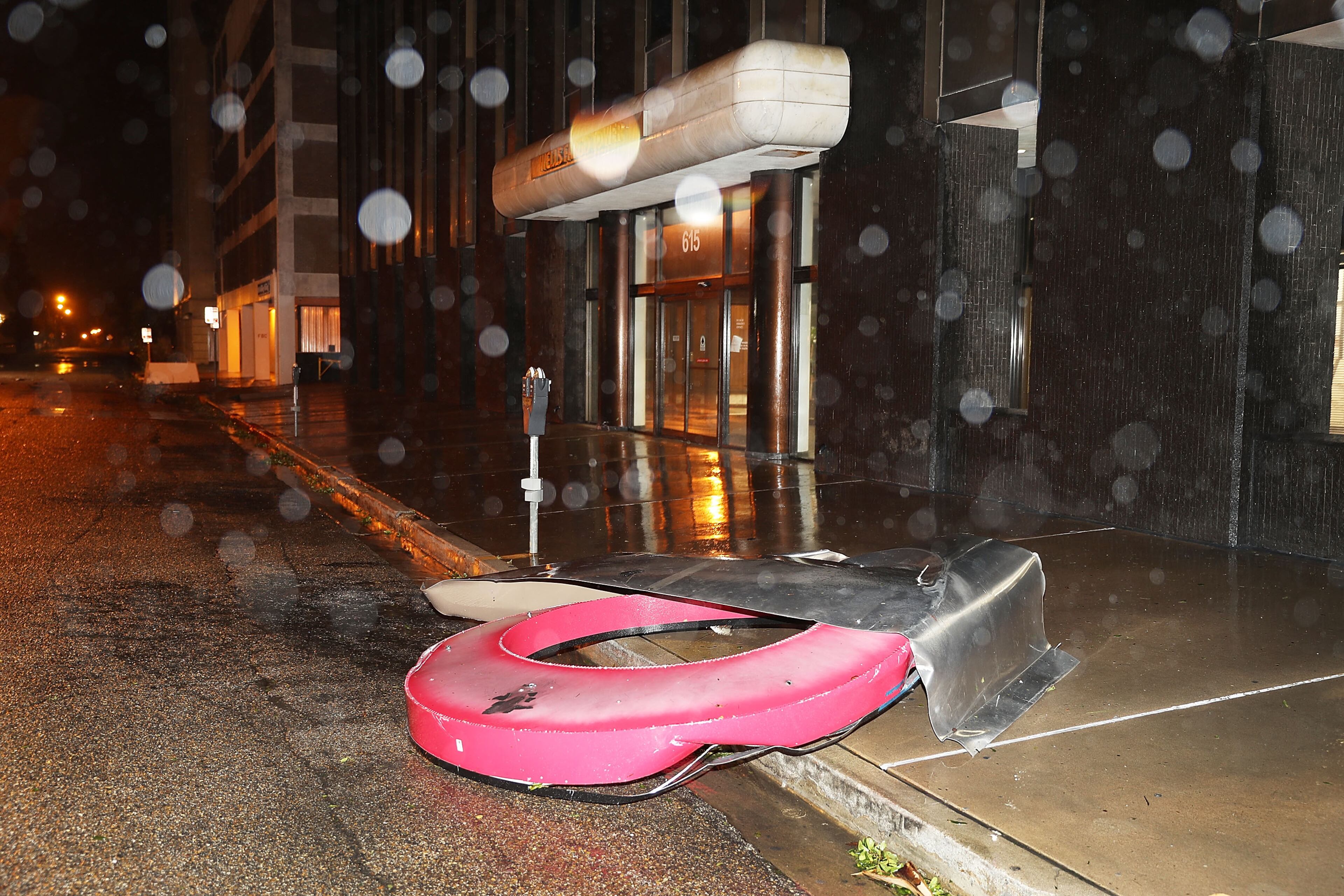 CORPUS CHRISTI, TX - AUGUST 26: debris is seen on the sidewalk during the passing of Hurricane Harvey on August 26, 2017 in Corpus Christi, Texas. Hurricane Harvey had intensified into a hurricane and hit the Texas coast as damage is being assessed. (Photo by Joe Raedle/Getty Images)