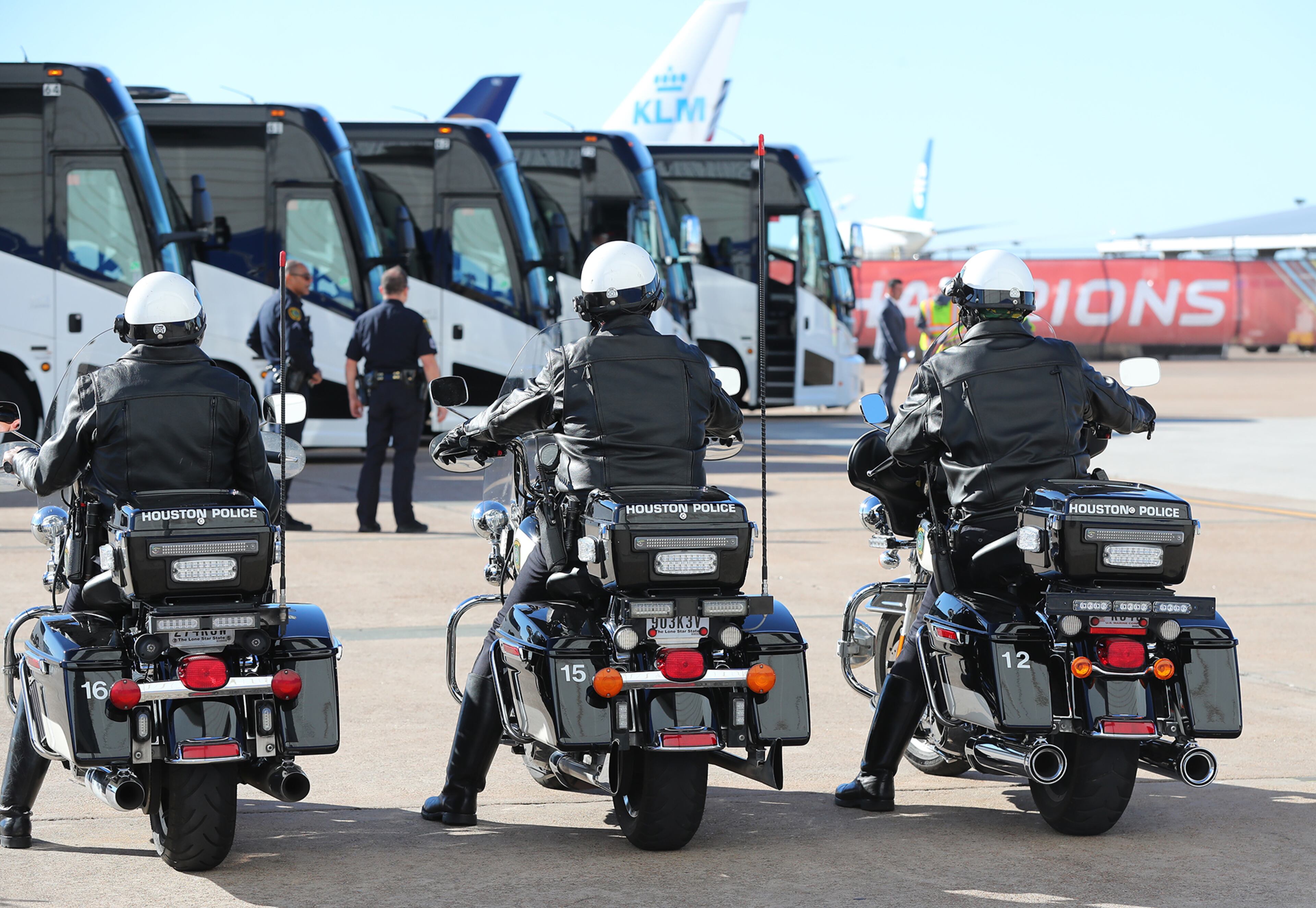Plenty of security is on hand with a Houston Police motorcycle unit preparing to escort five buses loaded with the Falcons team to their hotel during their arrival at George W. Bush Intercontinental Airport for the Super Bowl on Sunday, Jan. 29, 2017, in Houston.