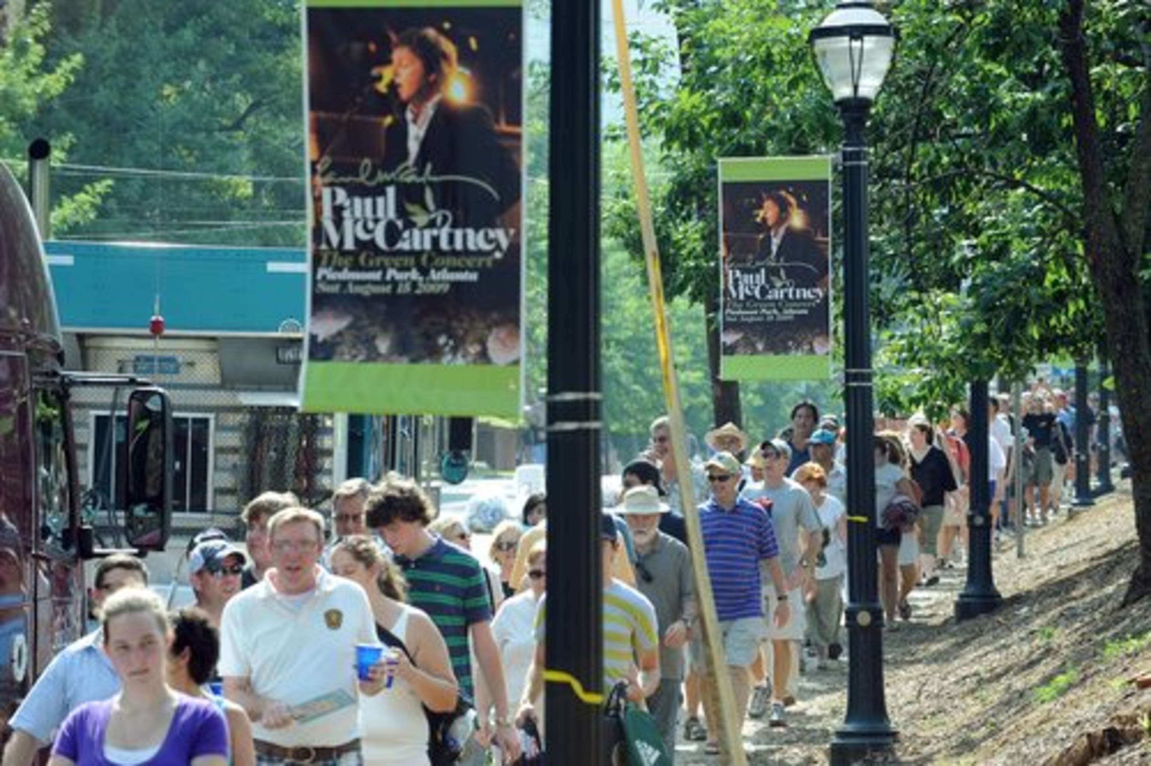 A LONG line of people trudges up 10th Street to the entrance for general ticket holders. This environmentally themed concert will raise funds for the park's 53-acre expansion. No cars were allowed near the concert entrance.