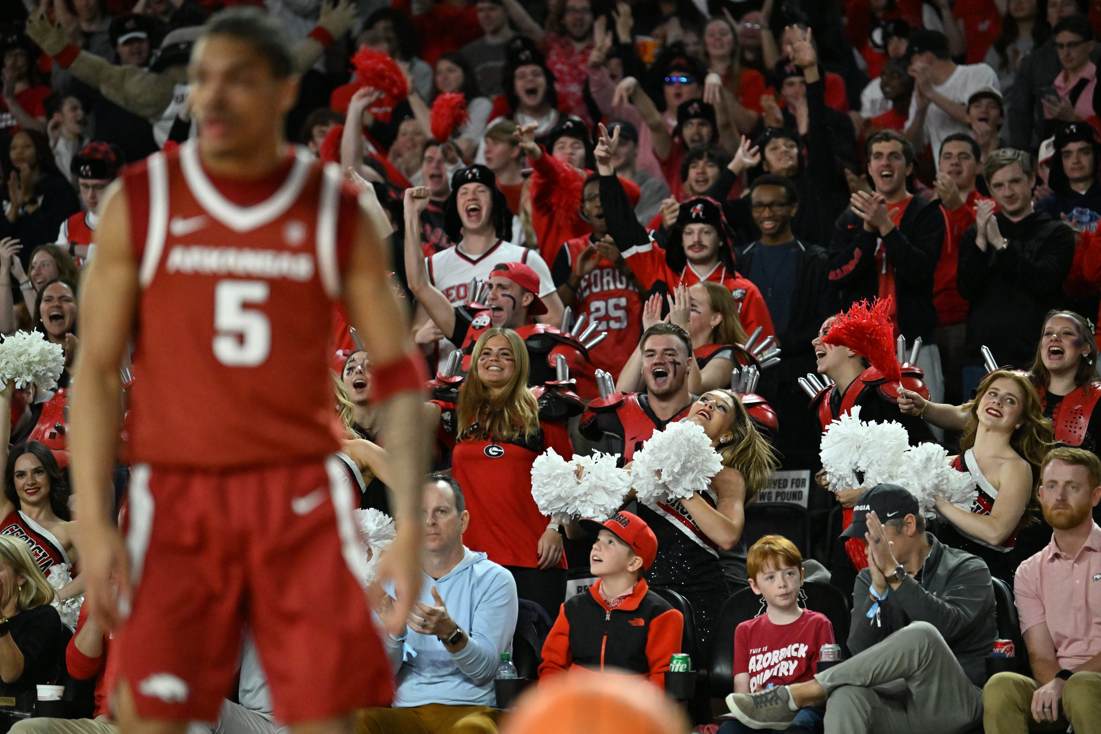 Georgia fans react after scoring during the first half in an NCAA college basketball game at Stegeman Coliseum, Saturday, Jan. 17, 2026, in Athens. (Hyosub Shin/AJC)
