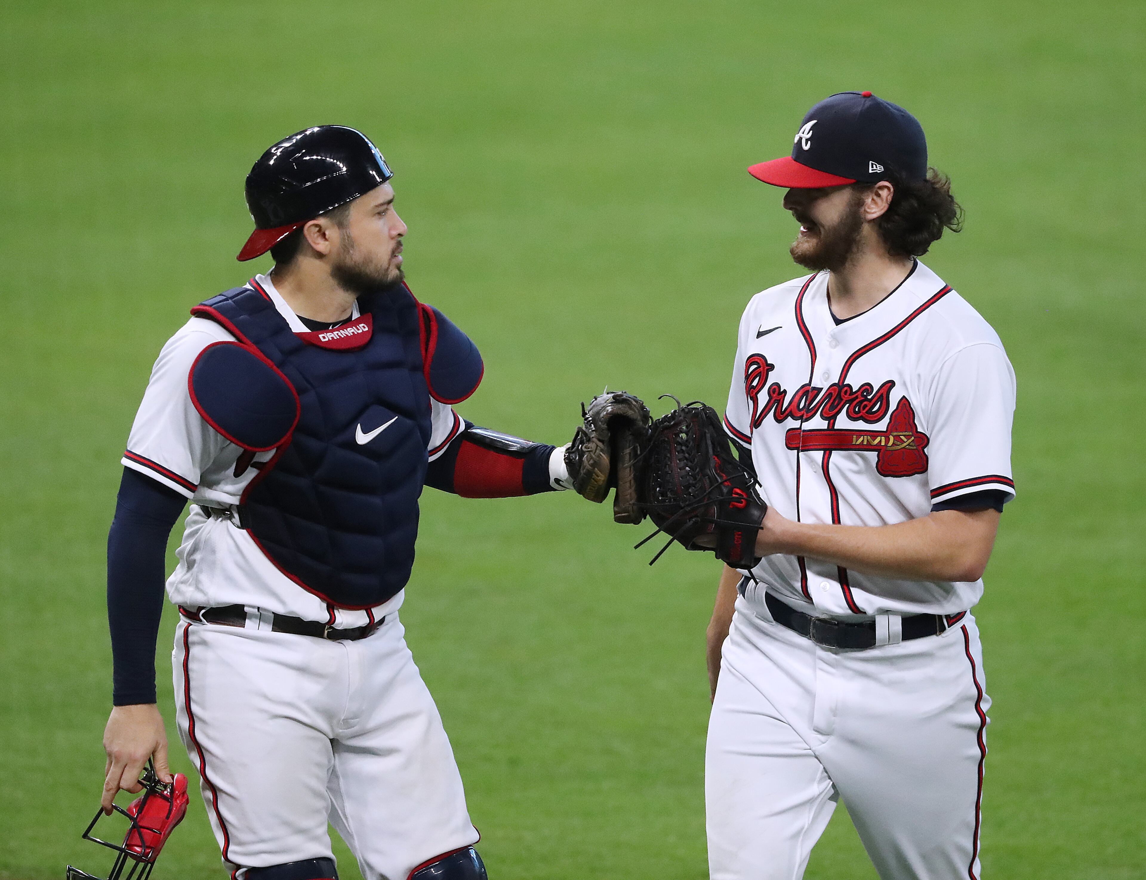 Atlanta Braves catcher Travis d’Arnaud gives starting pitcher Ian Anderson a glove bump against the Miami Marlins in Game 2 of a National League Division Series at Minute Maid Park on Wednesday, Oct 7, 2020 in Houston. Anderson went 5 2/3 innings in a 2-0 victory over the Marlins for a 2 game to none lead in the series. “Curtis Compton / Curtis.Compton@ajc.com”