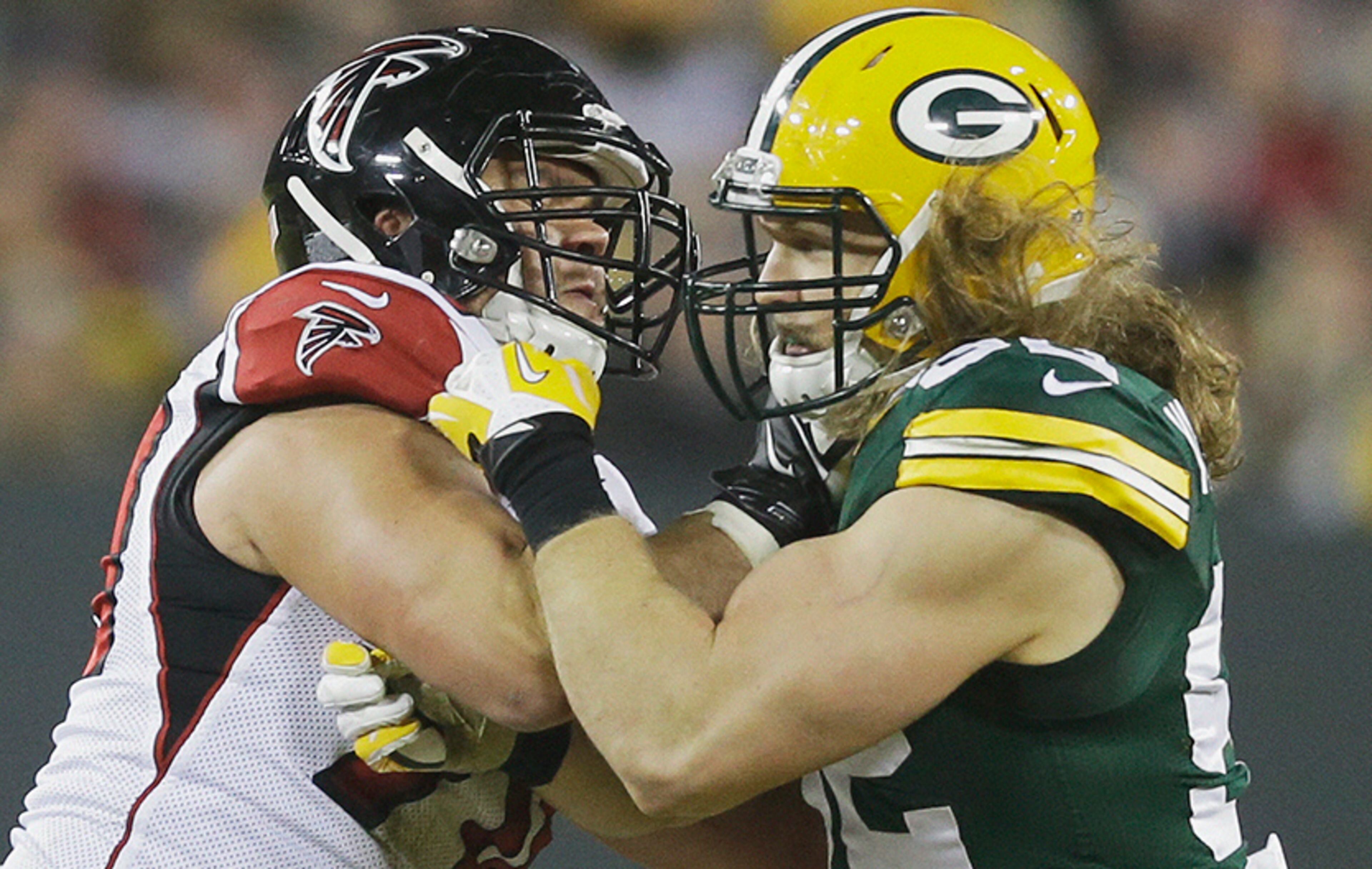 Atlanta Falcons' Jake Matthews (70) tries to block his cousin Green Bay Packers' Clay Matthews (52) during the second half Monday, Dec. 8, 2014, in Green Bay, Wis.