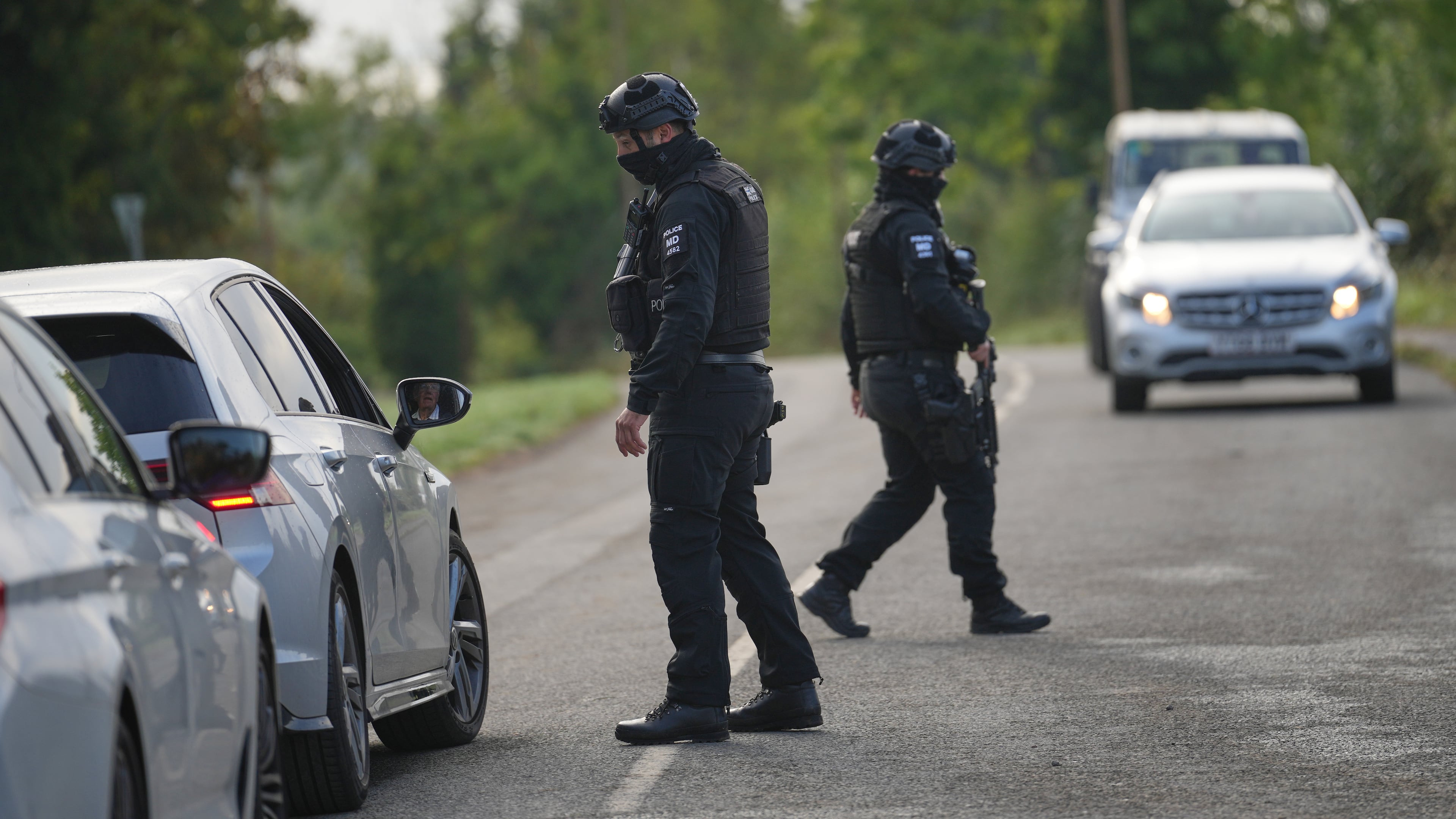 Police guard a road leading to RAF Fairford, in Fairford, England, Monday, Sept. 28, 2026. (AP Photo/Alastair Grant)