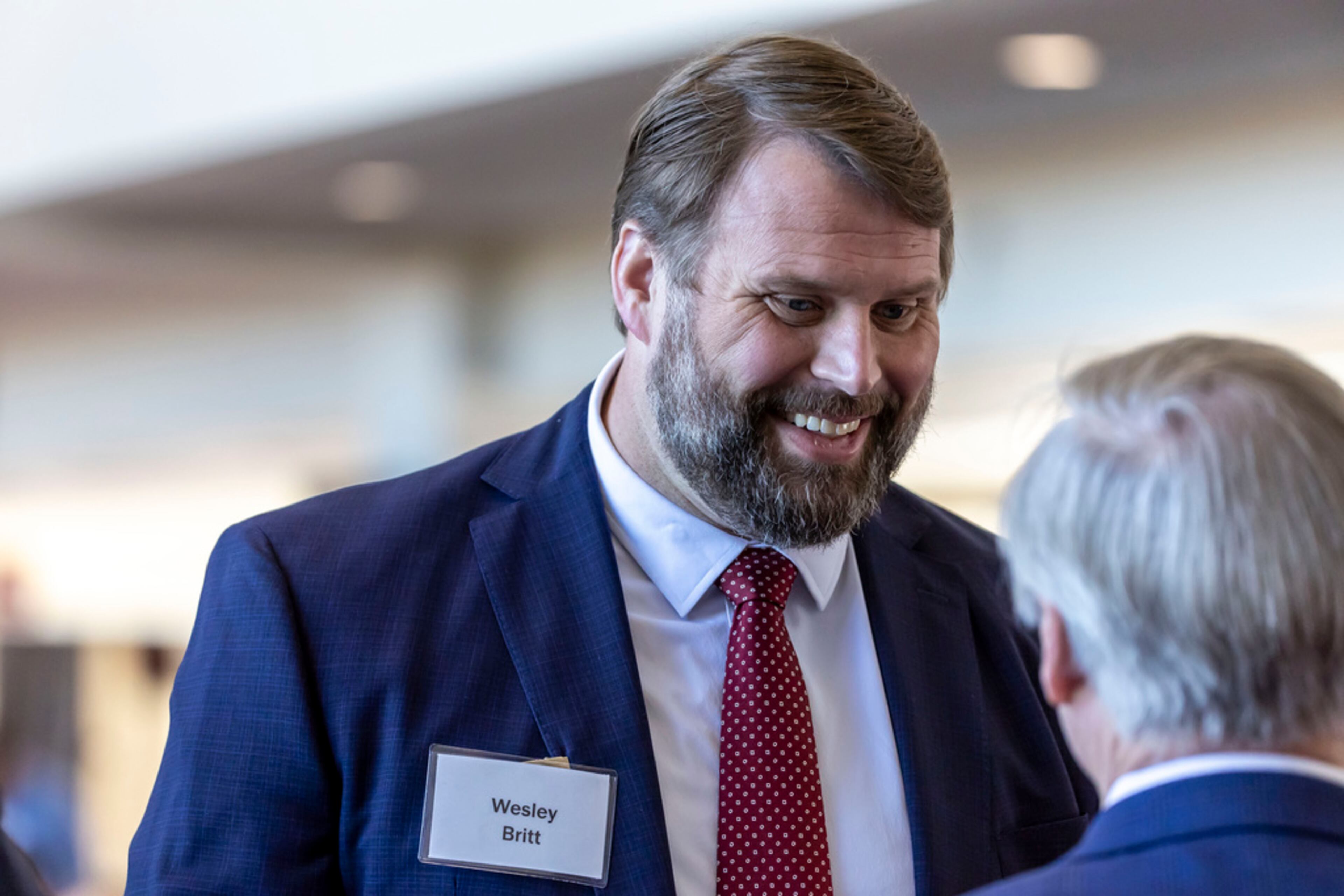 Former Alabama player Wesley Britt, husband of US Senator Katie Britt, arrives before new football head coach Kalen DeBoer gives his introductory speech, at Bryant-Denny Stadium, Saturday, Jan. 13, 2024, in Tuscaloosa, Ala. DeBoer is replacing the recently retired Nick Saban. (AP Photo/Vasha Hunt)