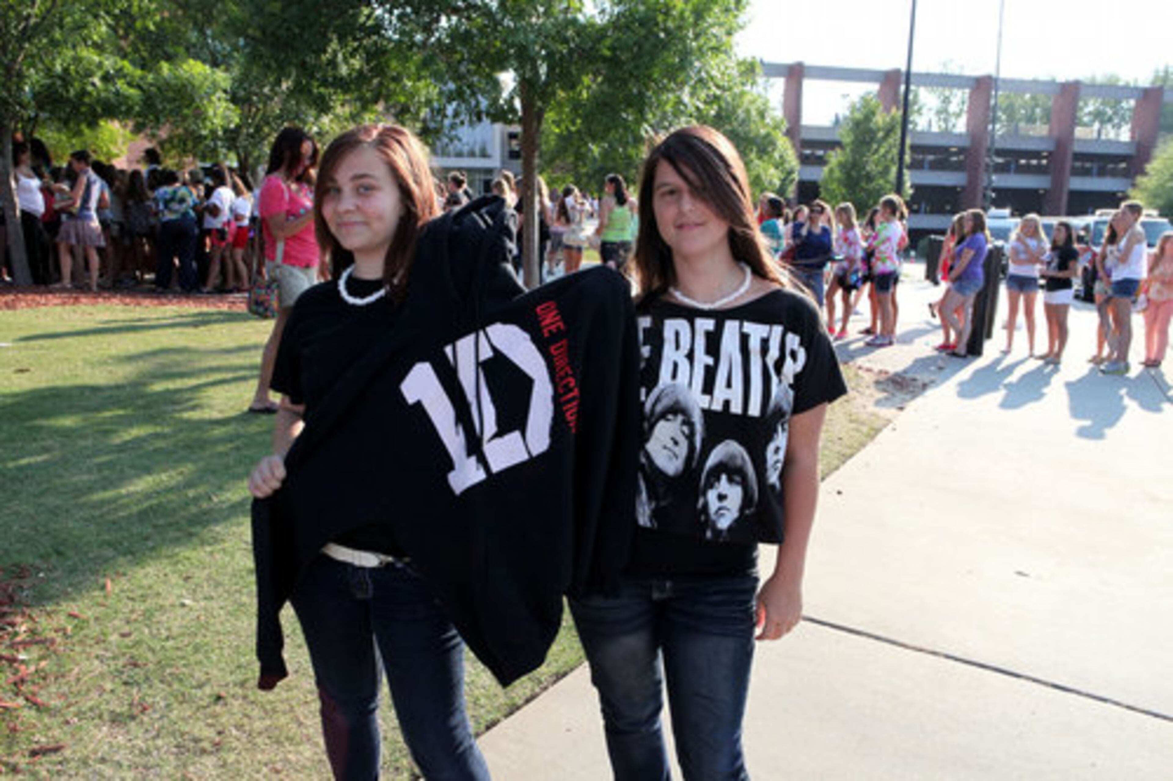 The atmosphere was reminiscent of Beatlemania as Destiney and Brittney Smallwood wait to enter Gwinnett Arena for the show.