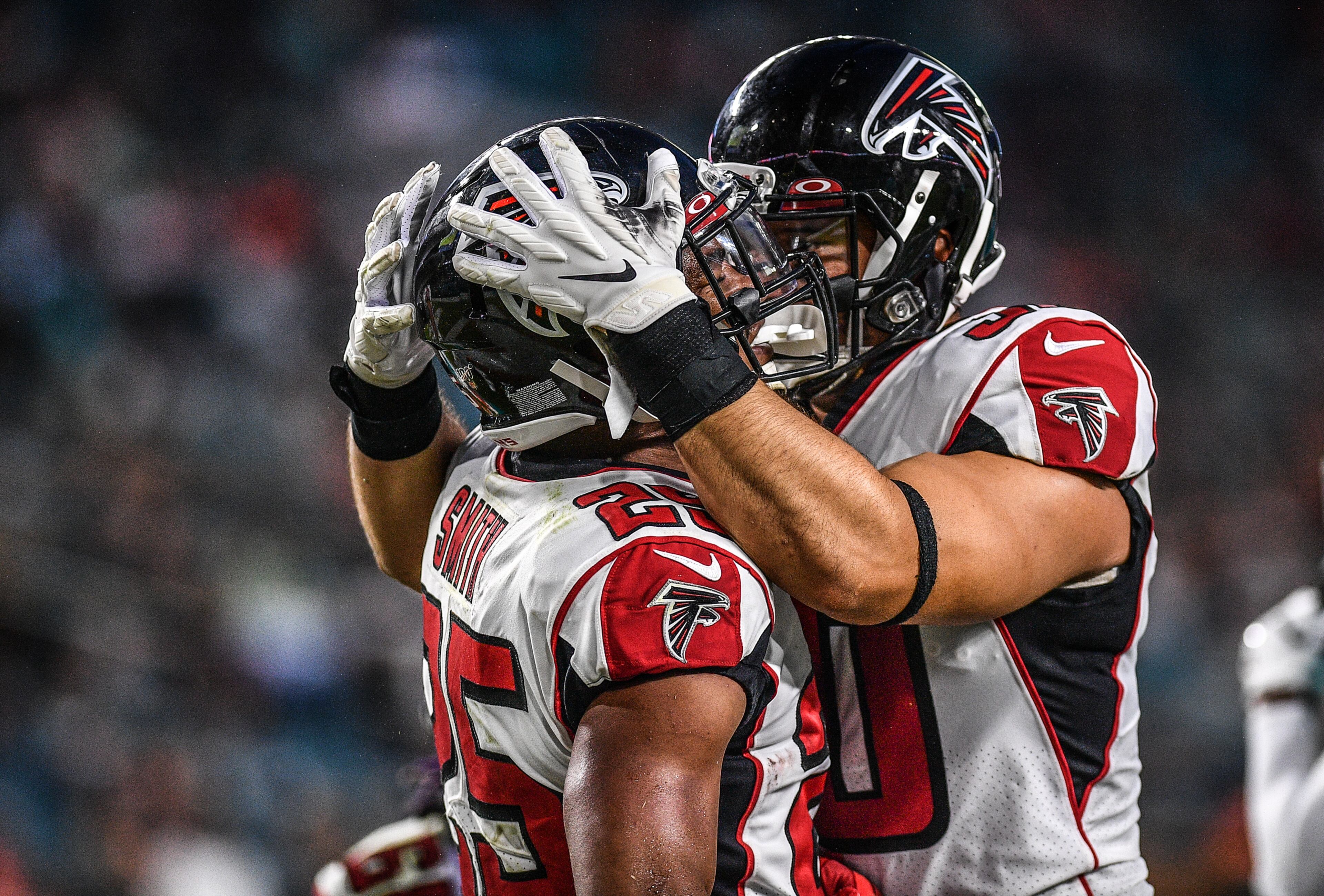 Ito Smith #25 of the Atlanta Falcons celebrates with Ricky Ortiz #30 after scoring a touchdown in the first quarter during a preseason game against the Miami Dolphins at Hard Rock Stadium on August 8, 2019 in Miami, Florida. (Photo by Mark Brown/Getty Images)