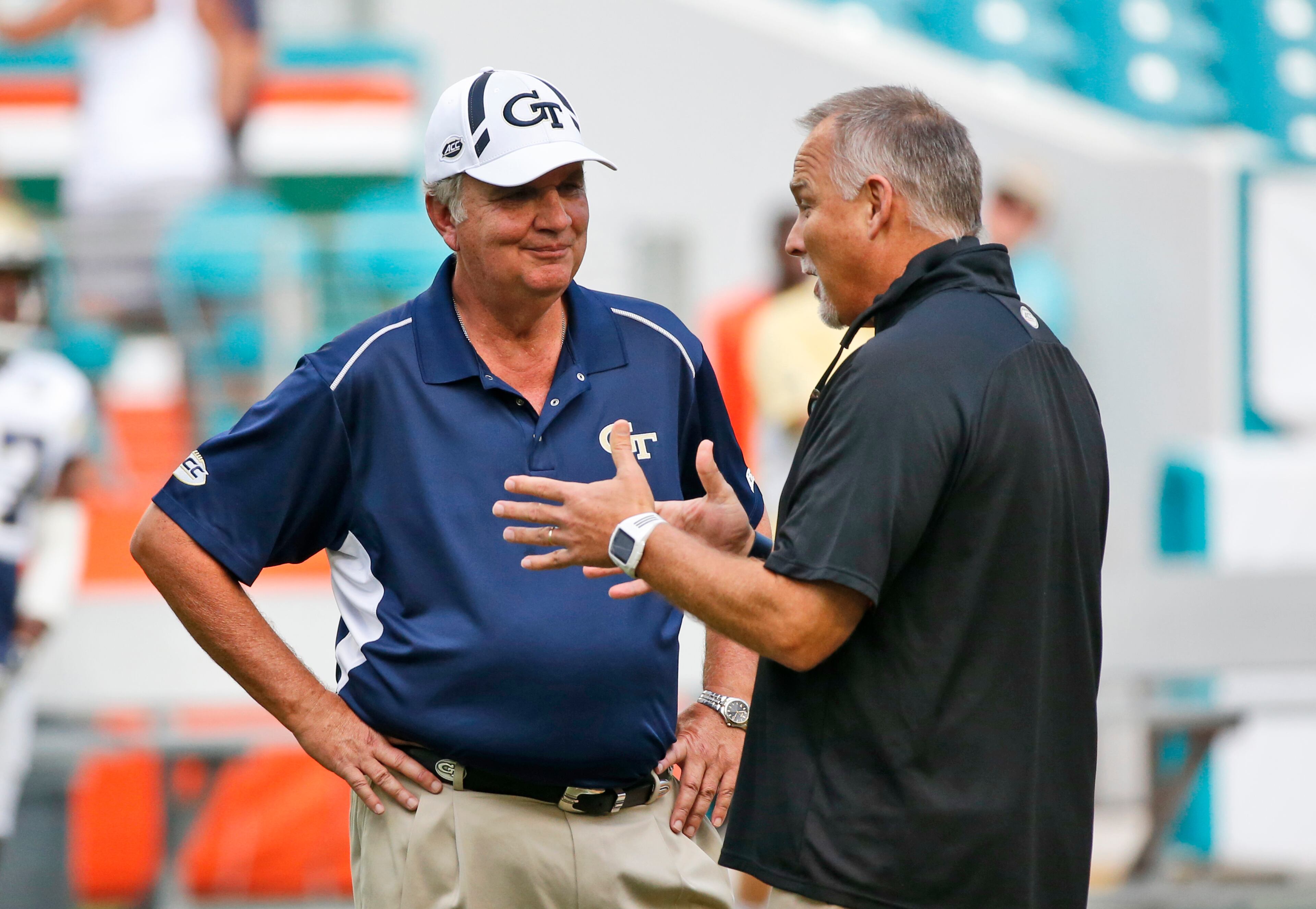 Georgia Tech head coach Paul Johnson chats with Miami coach Mark Richt before the start of Saturday's game in Miami Gardens, Fla. (AP Photo/Wilfredo Lee)