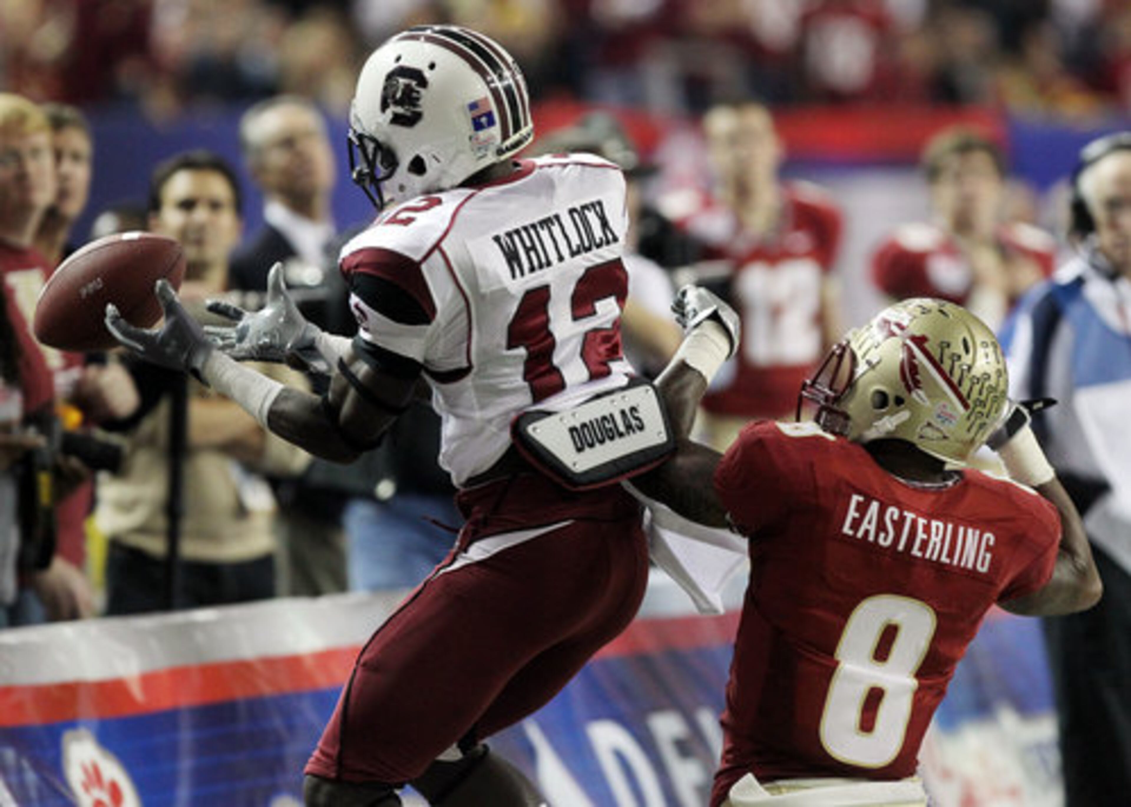 South Carolina cornerback Seth Whitlock, left, can't hold on to the interception as he defends Florida State wide receiver Taiwan Easterling during 1st half action in the Chick-fil-A Bowl at the Georgia Dome in Atlanta on Friday, Dec. 31, 2010.