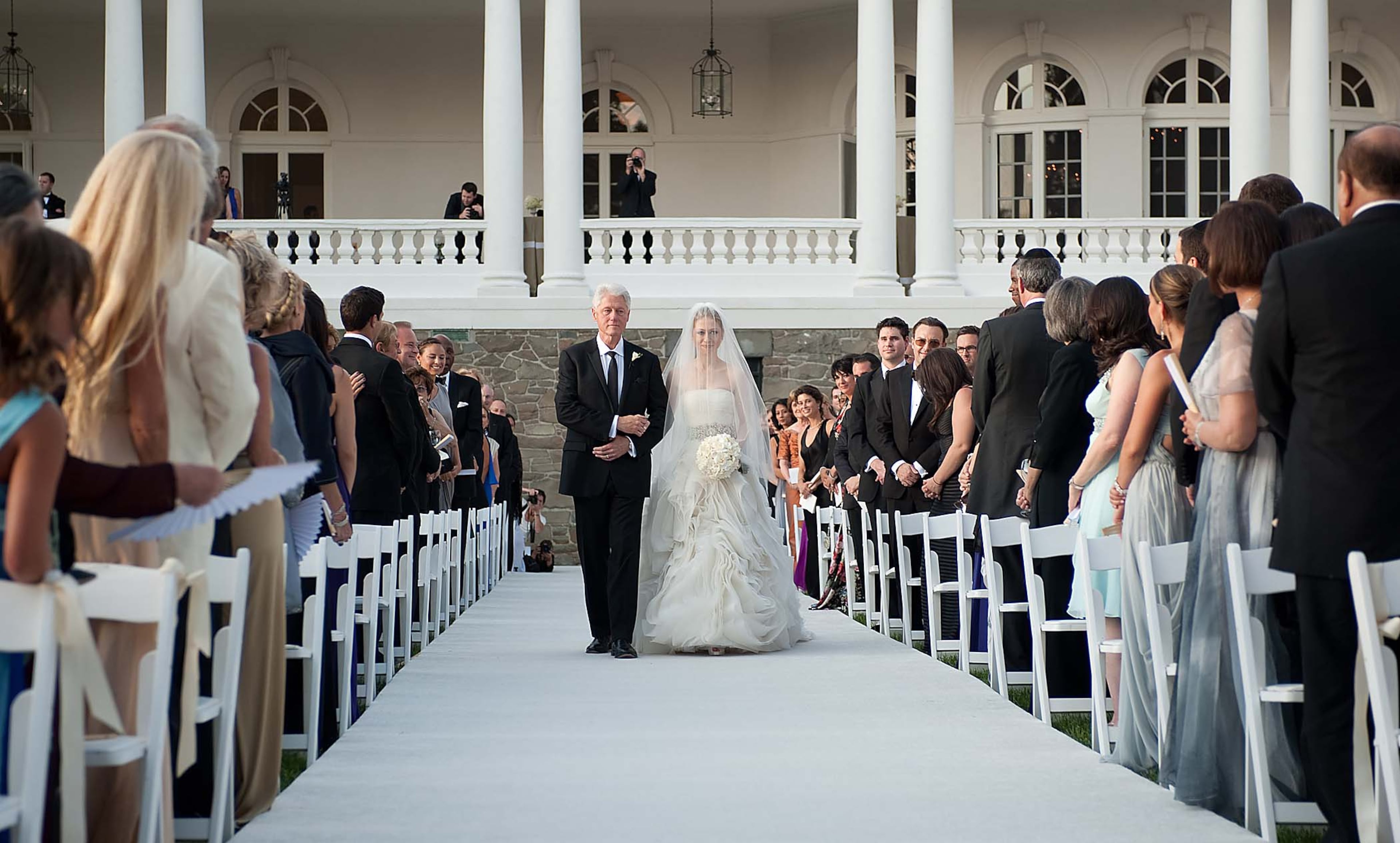 This photo released by Genevieve de Manio Photography shows former President Bill Clinton walking his daughter Chelsea down the isle for her wedding Saturday July 31, 2010 in Rhinebeck,N.Y. (Genevieve de Manio/Genevieve de Manio Photography)