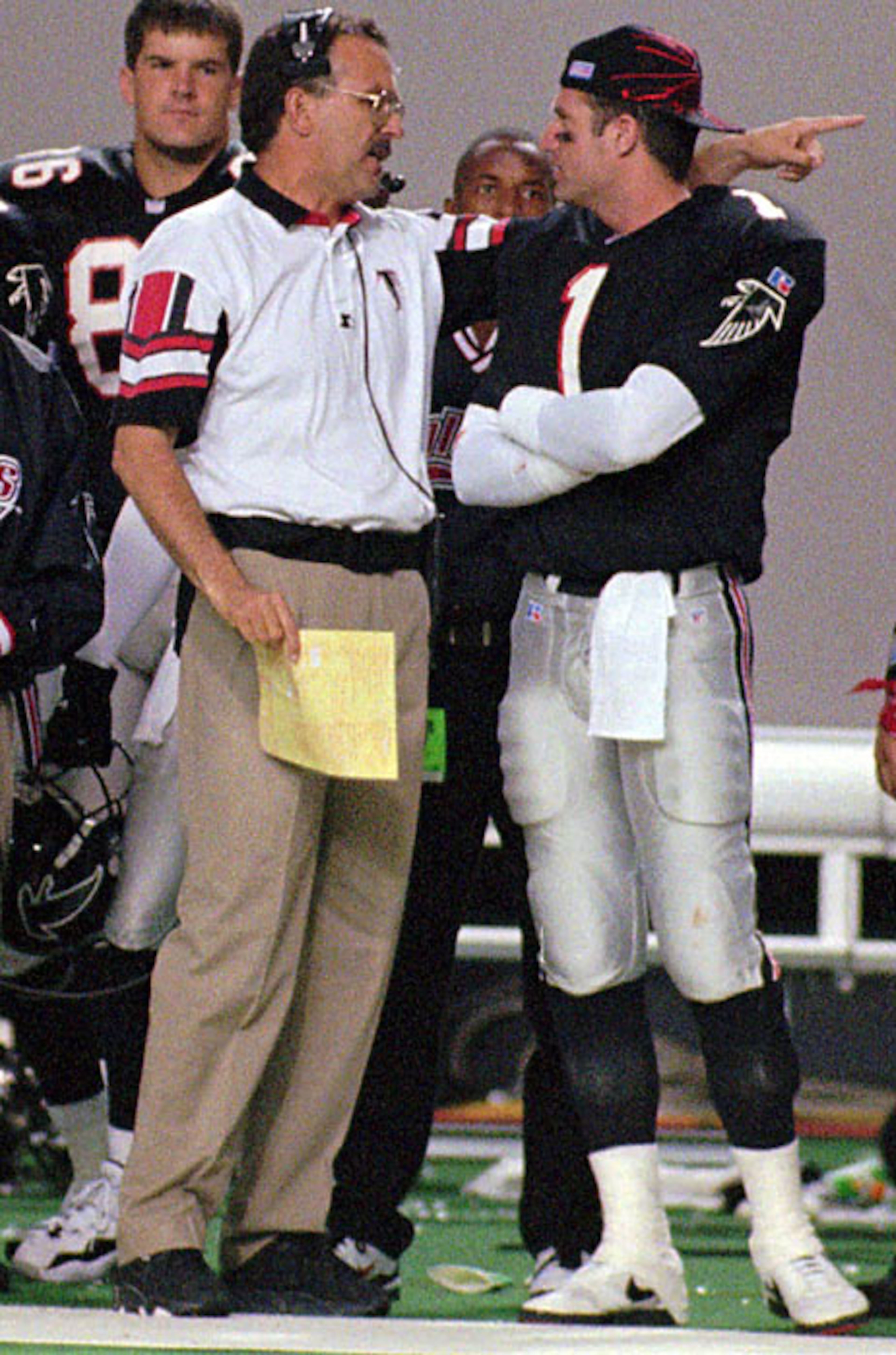 June Jones asks Jeff George to flip his lid. (AP)