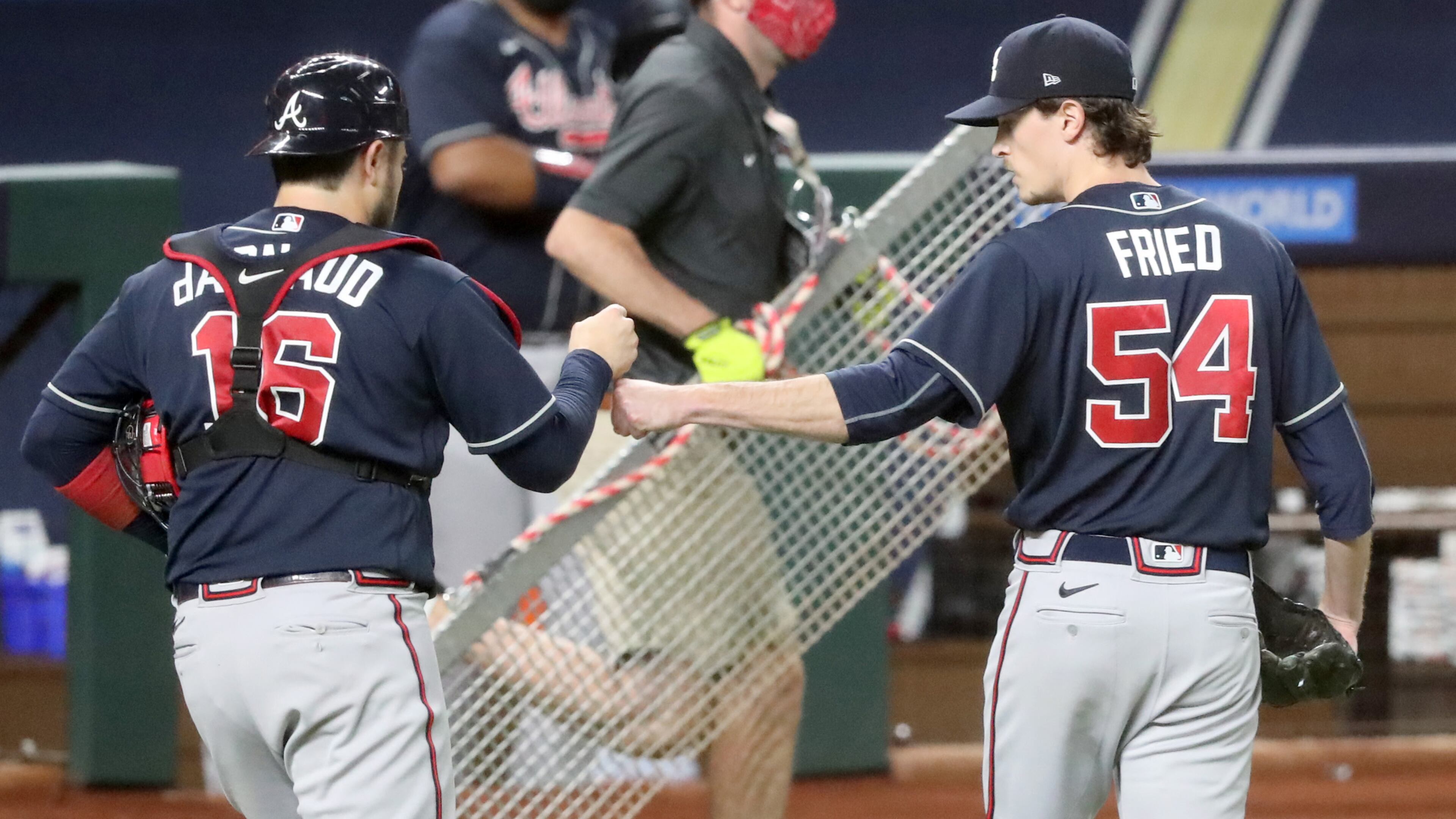 Max Fried gets a fist bump from catcher Travis d'Arnaud after the third inning.