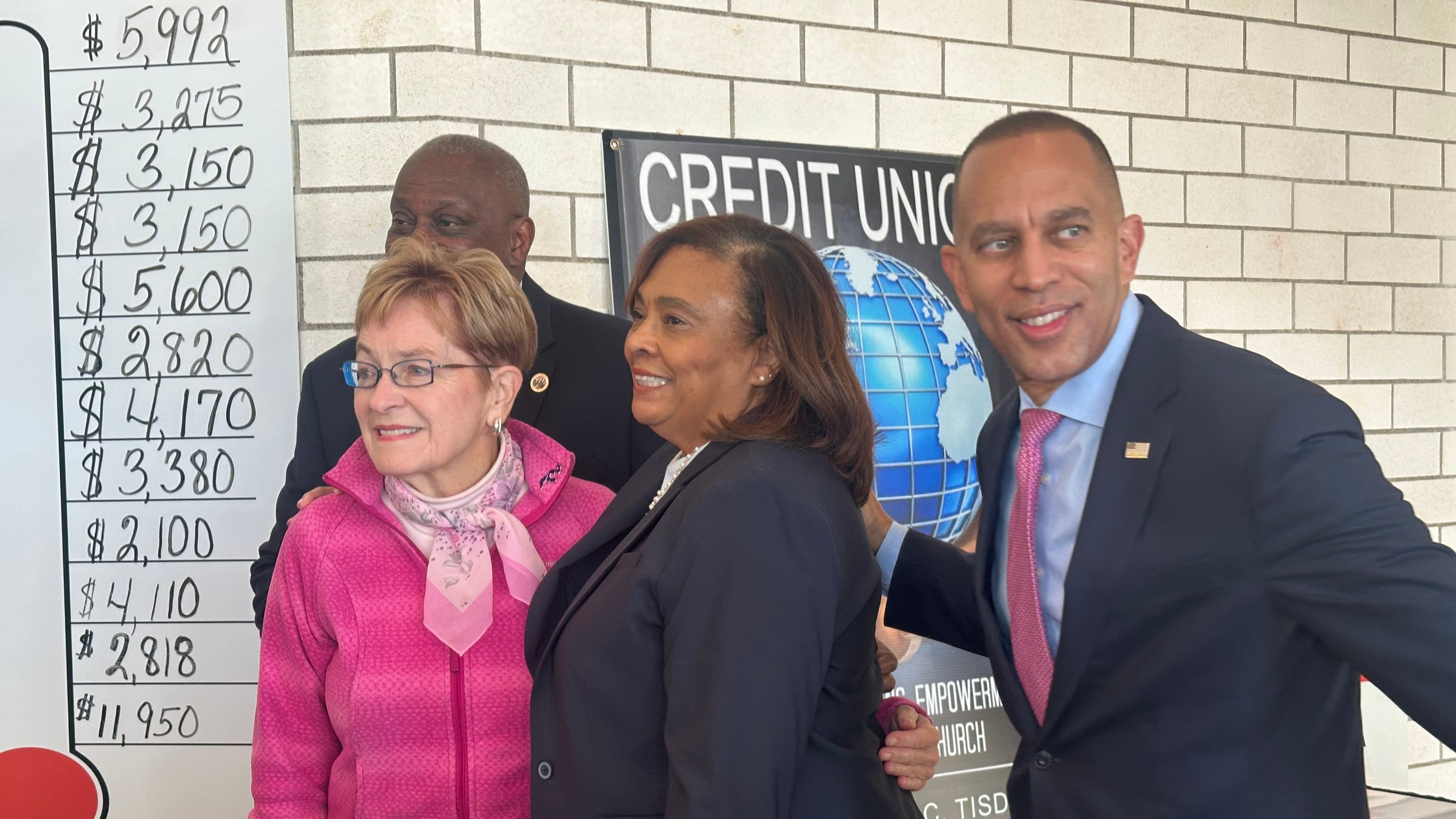 In this photo taken with a smartphone, House Democratic Leader Hakeem Jeffries, with Rep. Marcy Kaptur, D-Ohio, talk with people at the Friendship Baptist Church, on Oct. 18, 2026, in Toledo, Ohio. (AP Photo/Lisa Mascaro)