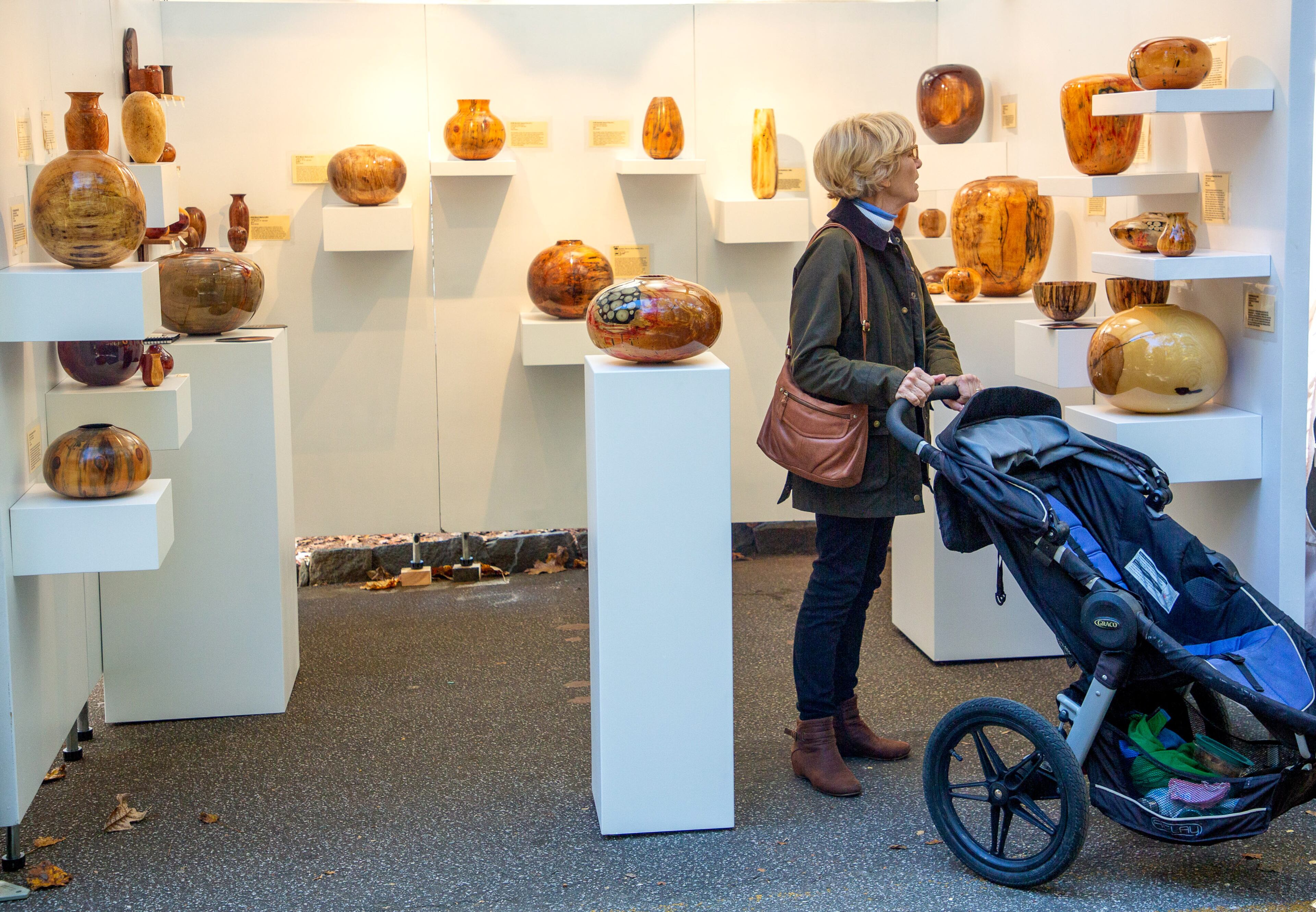 Linda Scott looks over Jason Martin's wood sculptures during the Chastain Park Fall Arts Festival on Sunday, November 7, 2021.
STEVE SCHAEFER FOR THE ATLANTA JOURNAL-CONSTITUTION