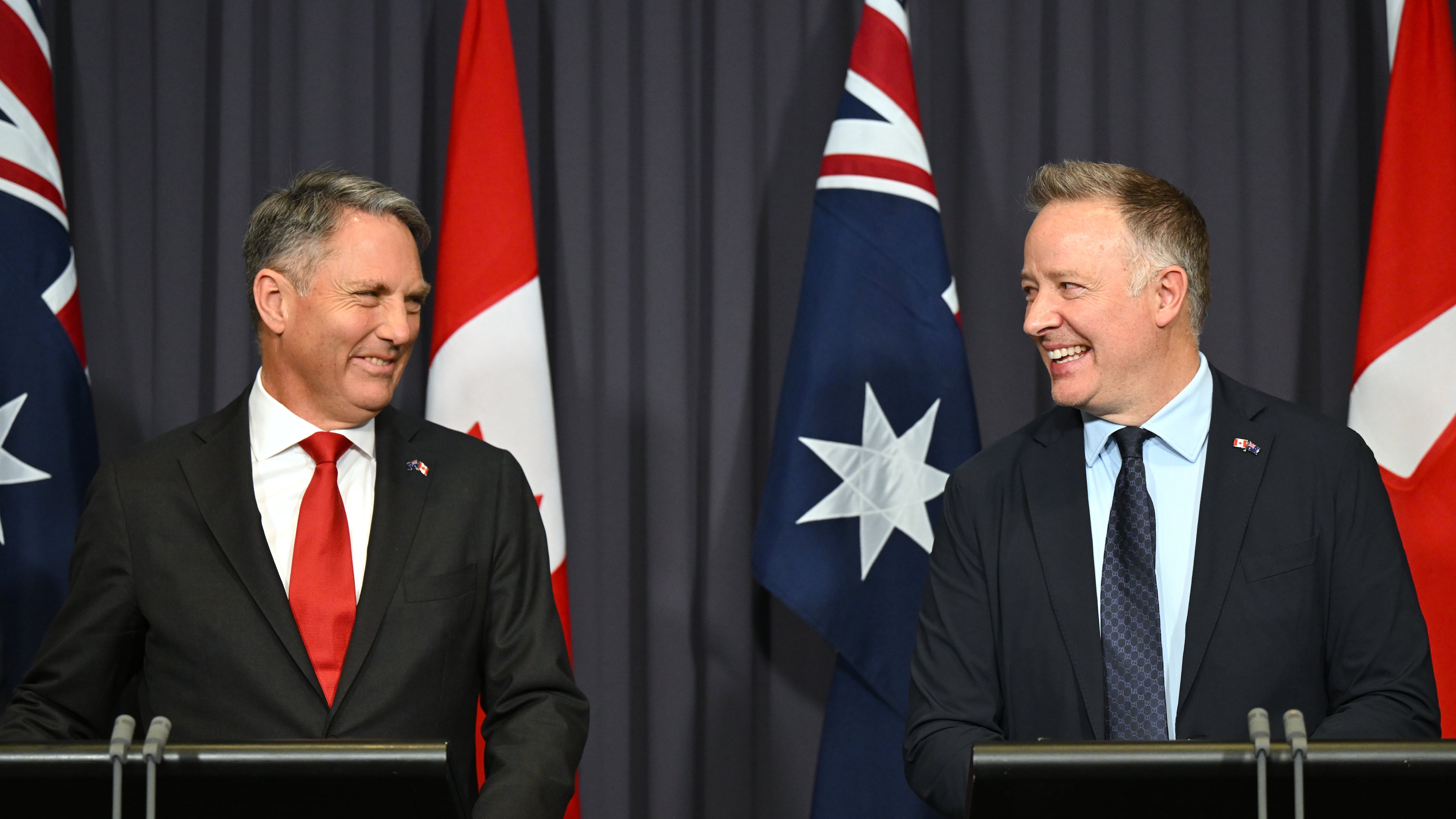 Australian Defense Minister Richard Marles, left, and Canada's Secretary of State Stephen Fuhr speak to the media after signing an agreement on export of an Over-the-Horizon Radar system at Parliament House in Canberra, Australia, Monday, June 22, 2026. (Lukas Coch/AAP Image via AP)