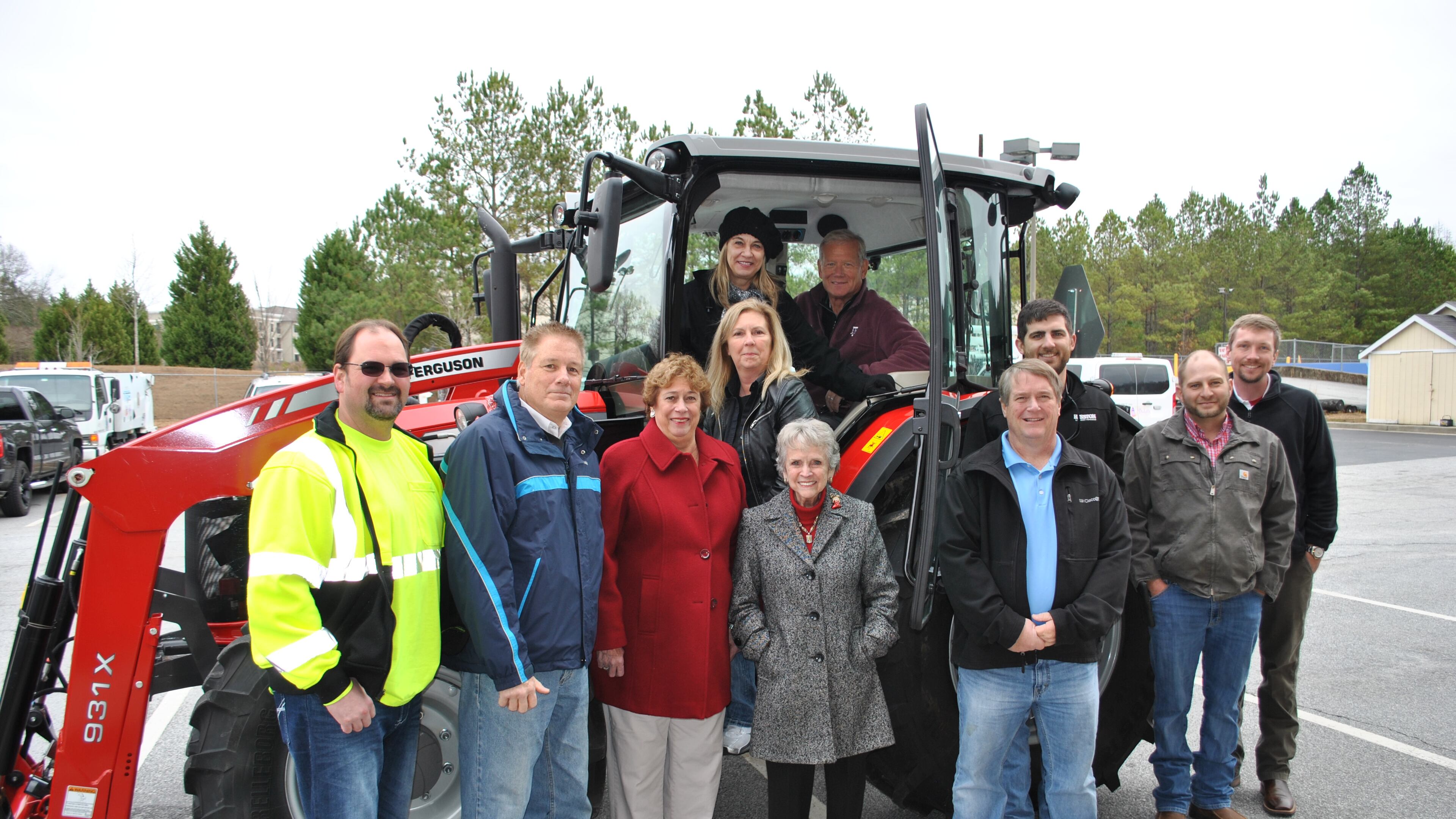 Duluth Public Works Department accepts donation of new tractor. Left to right: Deputy PW Director Jason Brock, Councilman Jim Dugan, Duluth Fall Festival Annette McIntosh, PW Director Audrey Turner, Duluth Fall Festival Katherine Willis, Mayor Nancy Harris, Councilman Kelly Kelkenberg, Councilman Billy Jones, AGCO Tom Kramer, Kabe Cain from Massey Ferguson, and AGCO Toby Bowen. Courtesy of City of Duluth