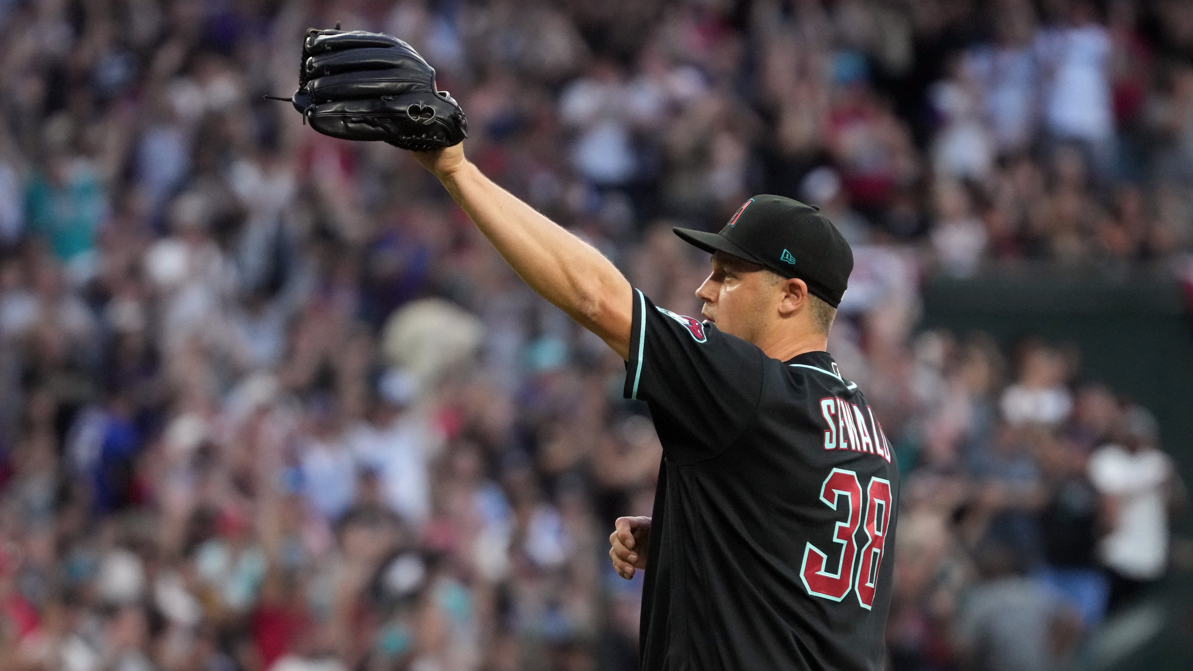 Arizona Diamondbacks pitcher Paul Sewald (38) celebrates after defeating the Atlanta Braves during a baseball game, Saturday, April 4, 2026, in Phoenix. (AP Photo/Rick Scuteri)