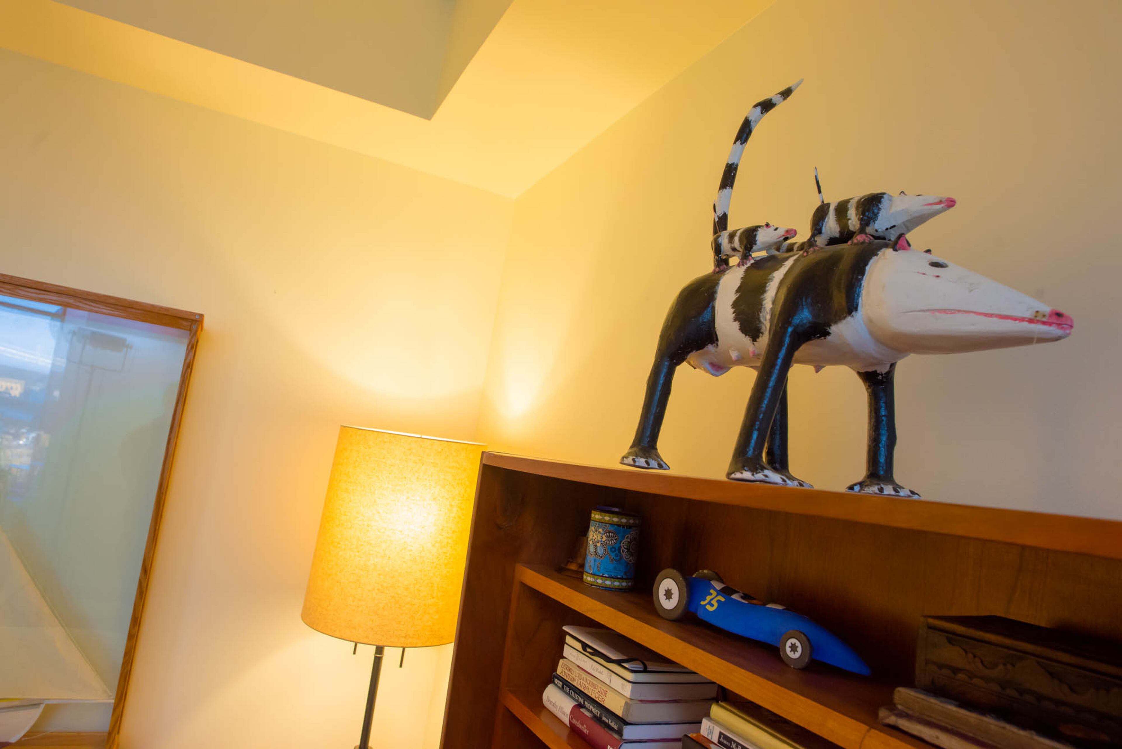 This unique piece in Pippa and Ron Seichrist's Atlanta home is a testament to their love for folk art. The possum sculpture, which was created by Isaac Smith, was discovered at Pippa's favorite folk gallery in Clayton. Text by Anna Logan/Fast Copy News Service.