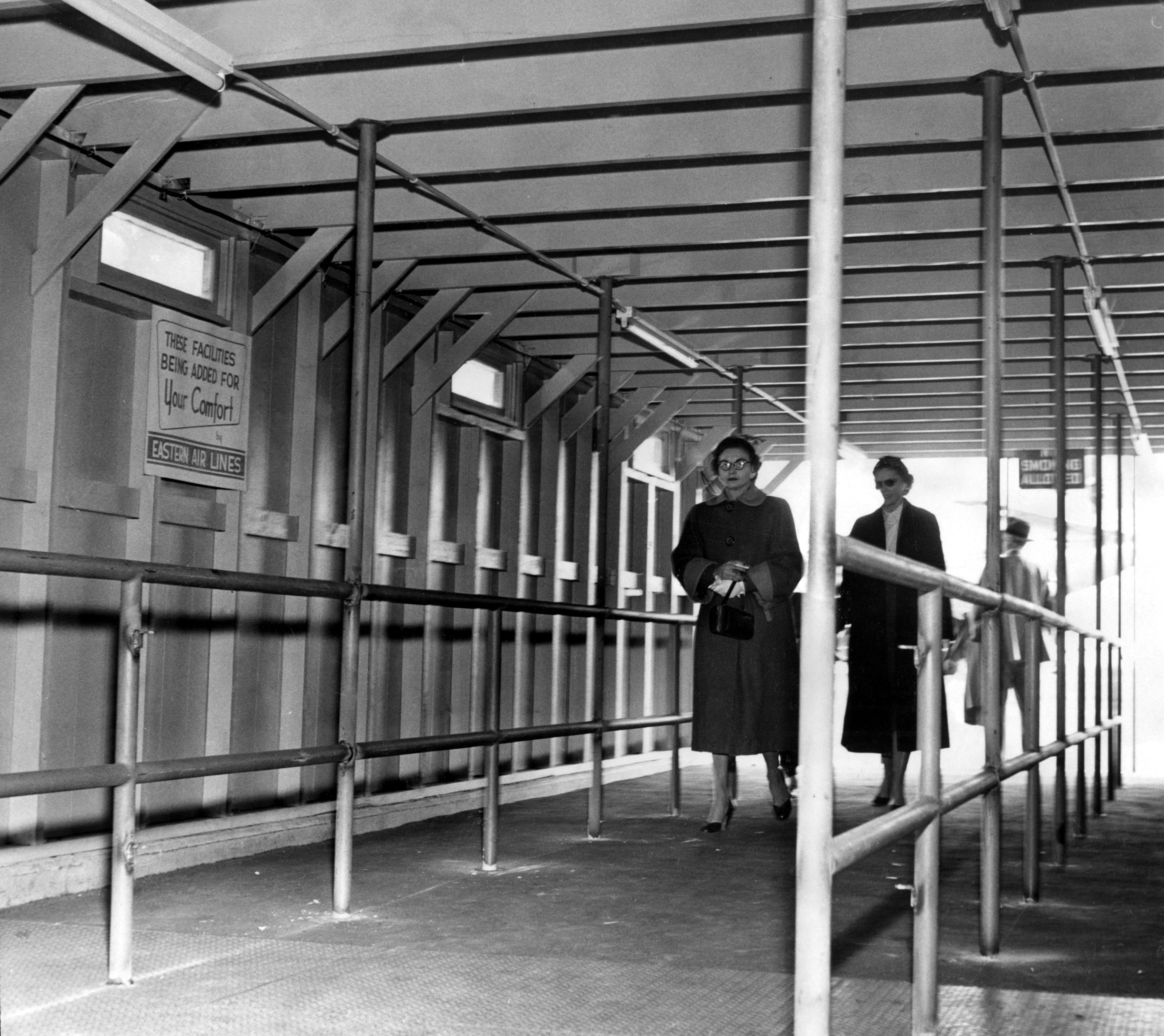 Dec. 1954 original caption: "Airlines have had to improve the Atlanta airport facilities themselves. Shown is the interior of one of the 'fingers' from the terminal which cost Eastern Airlines $25,000."